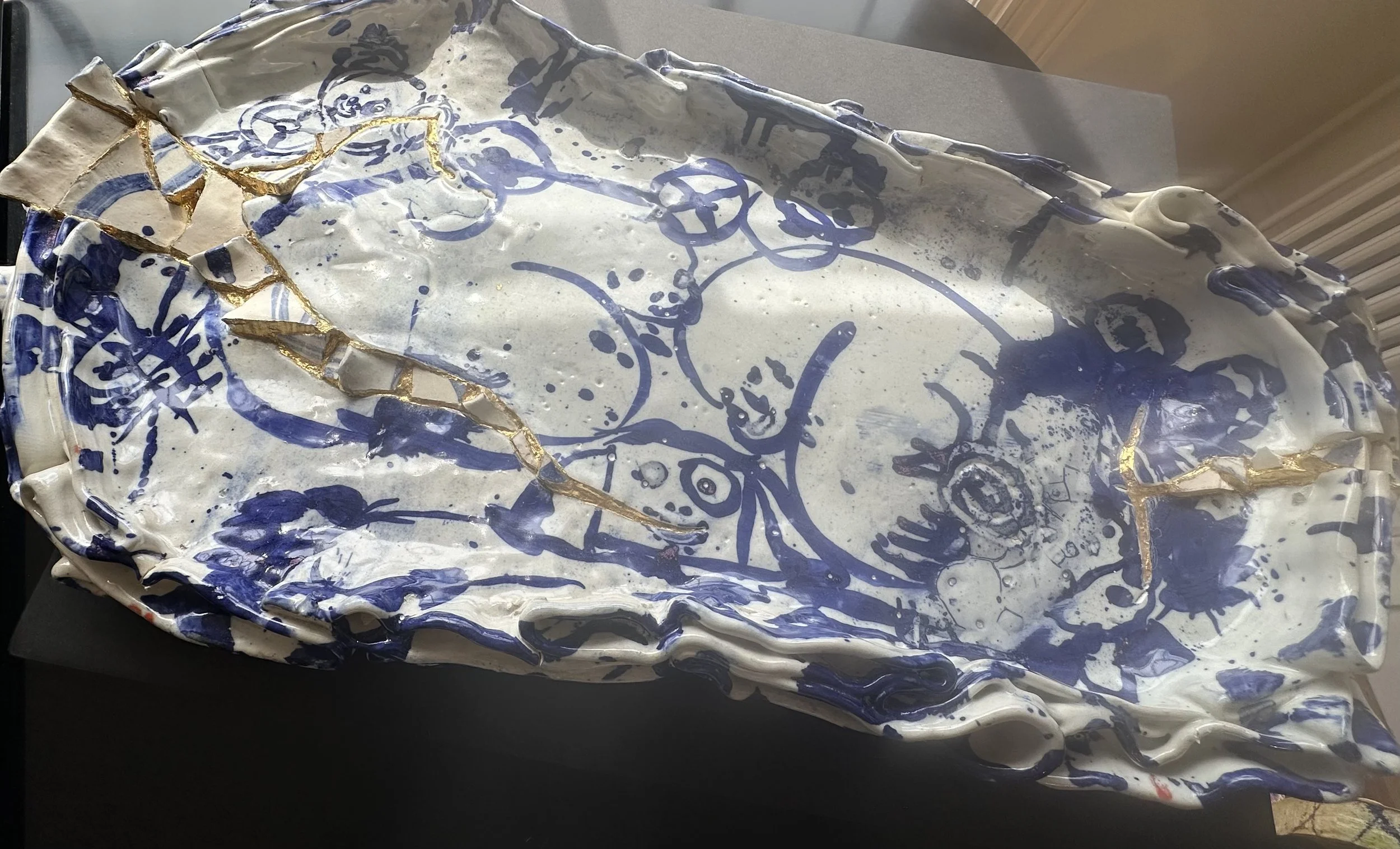 Mark Cooper . Platter 2025 . Ceramic, gold leaf . 40" x 20" x 4.5"