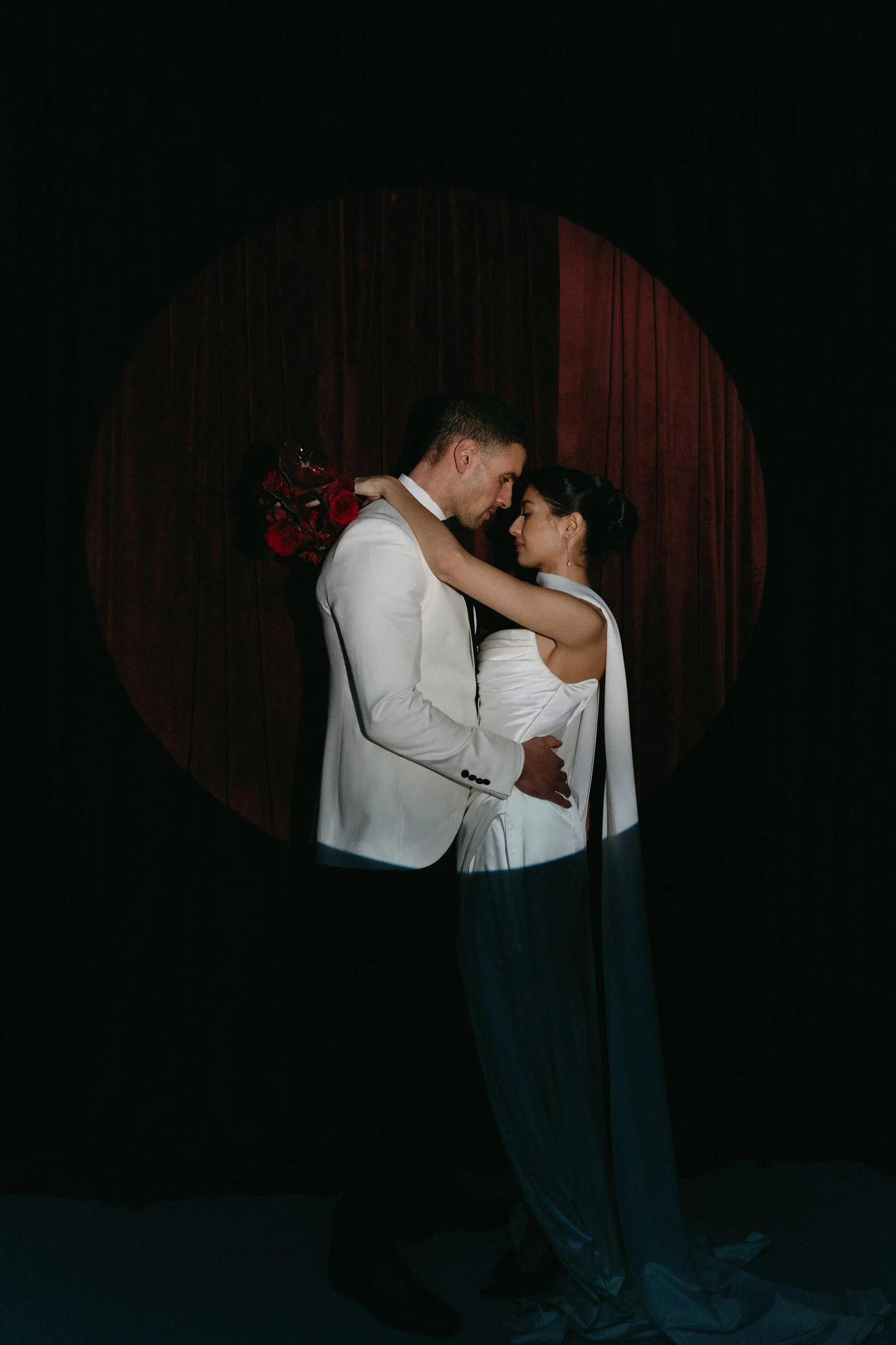 Intimate editorial wedding photos of a modern couple embracing in a refined and artistic wedding photos style.