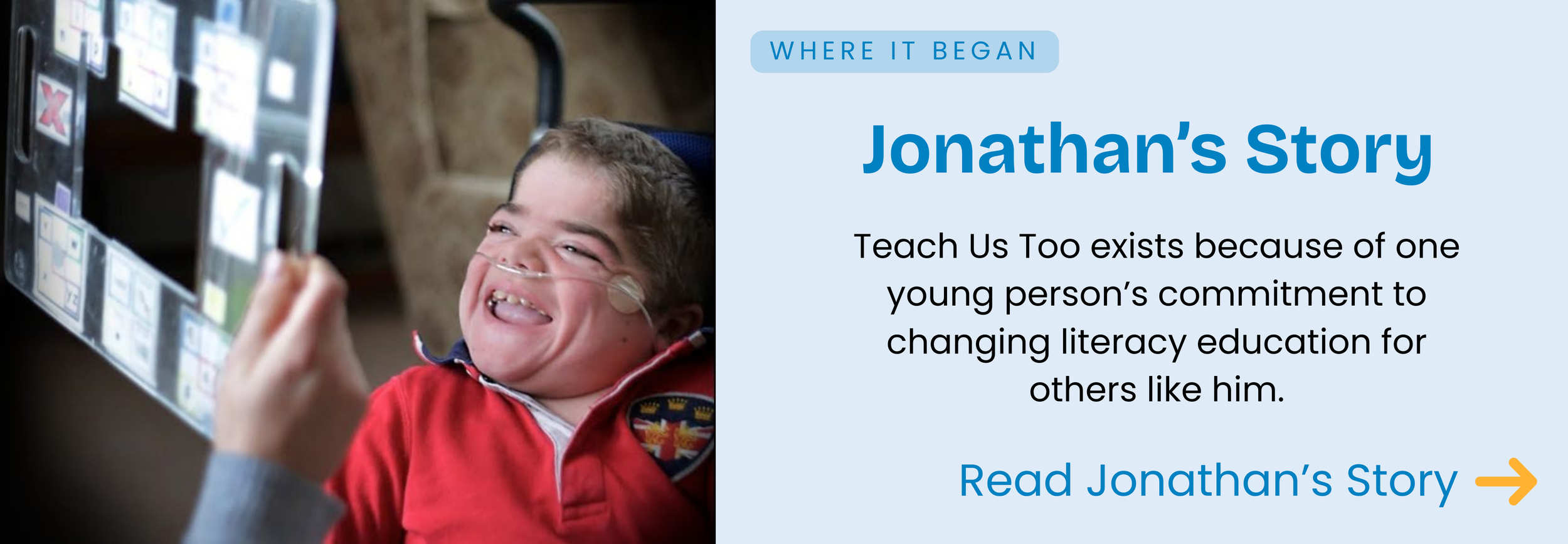 Young man using AAC spelling board and smiling