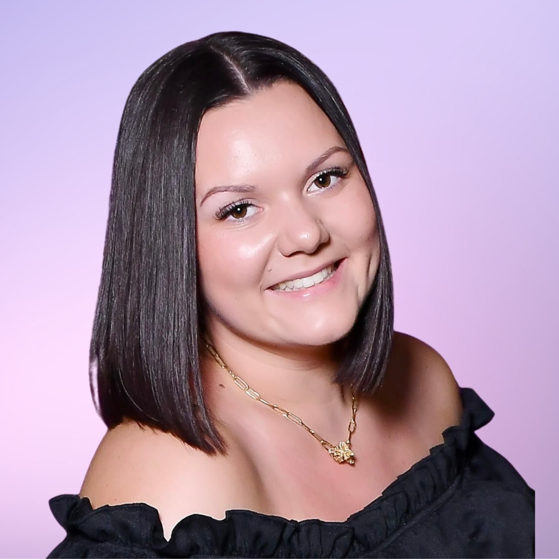 A woman with dark hair smiling at the camera