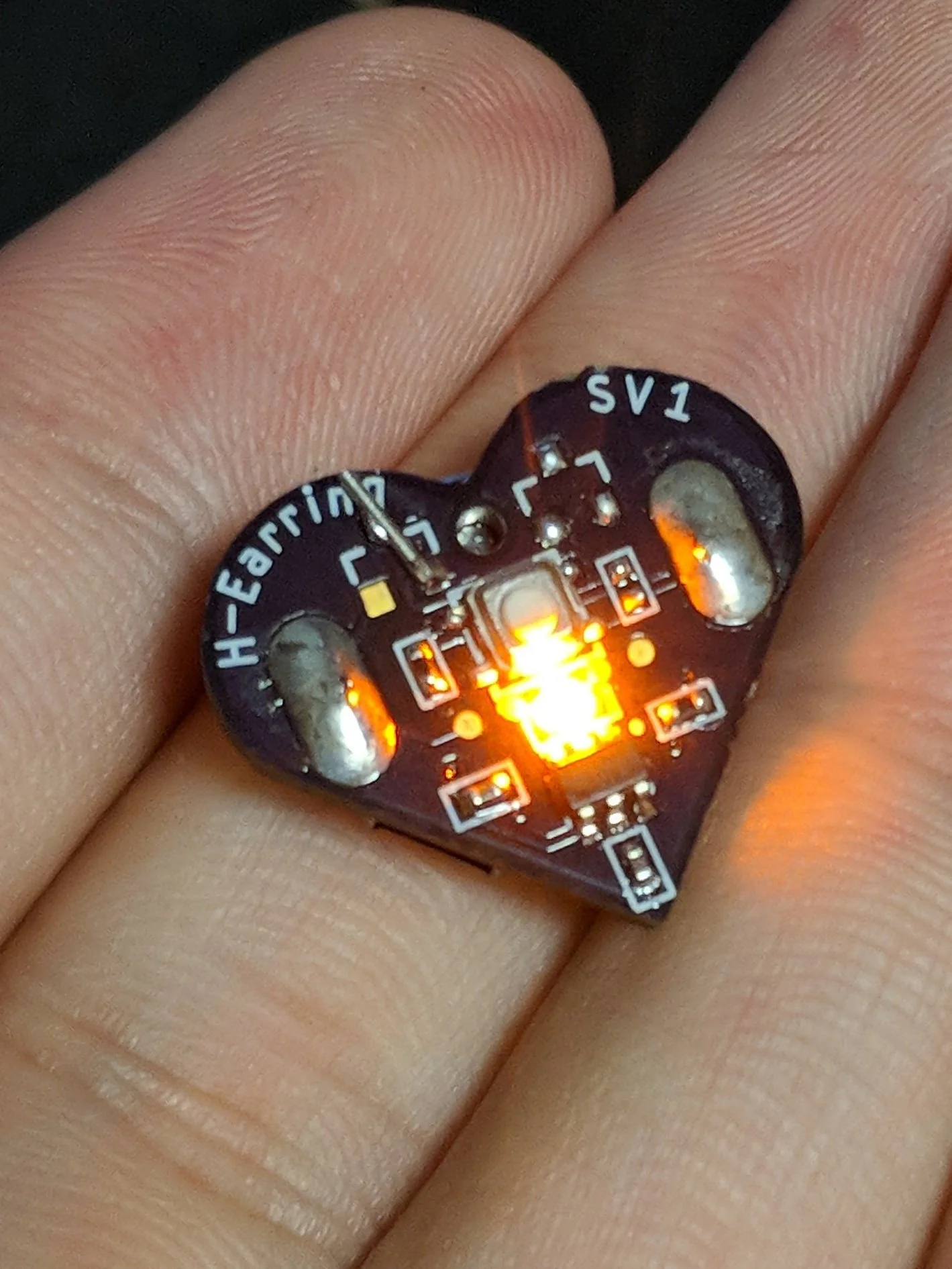 (2018) A wearable light up earring using an ATtiny 10 mcu. Uses a thermistor to measure ambient temperature and change the flashing rate of the LED.