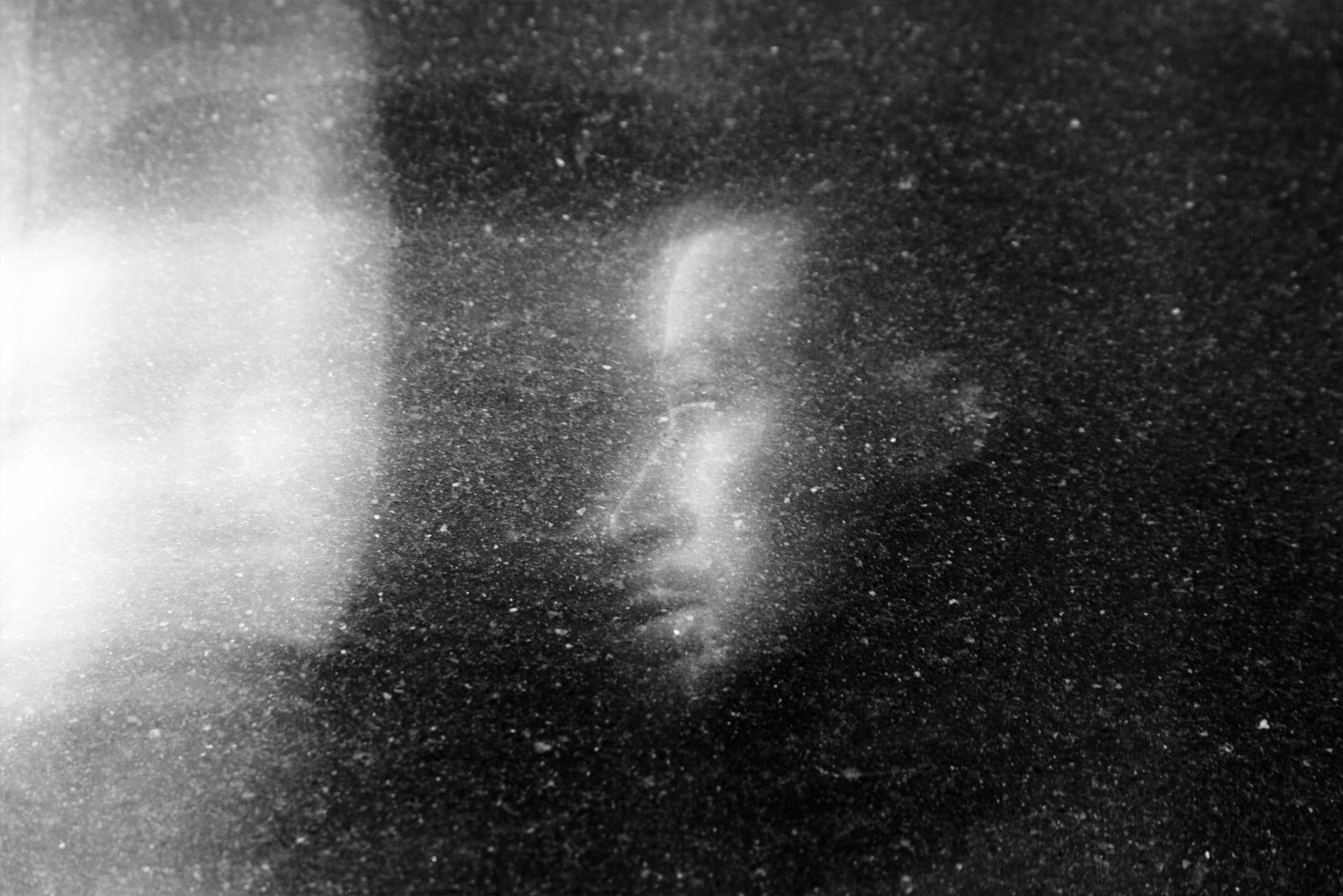 "Lost In Space" street portrait with cosmic, weightless feel as if walking in space. In-camera double exposure. Shot in Helsinki, Finland by Oscar Wollsten.