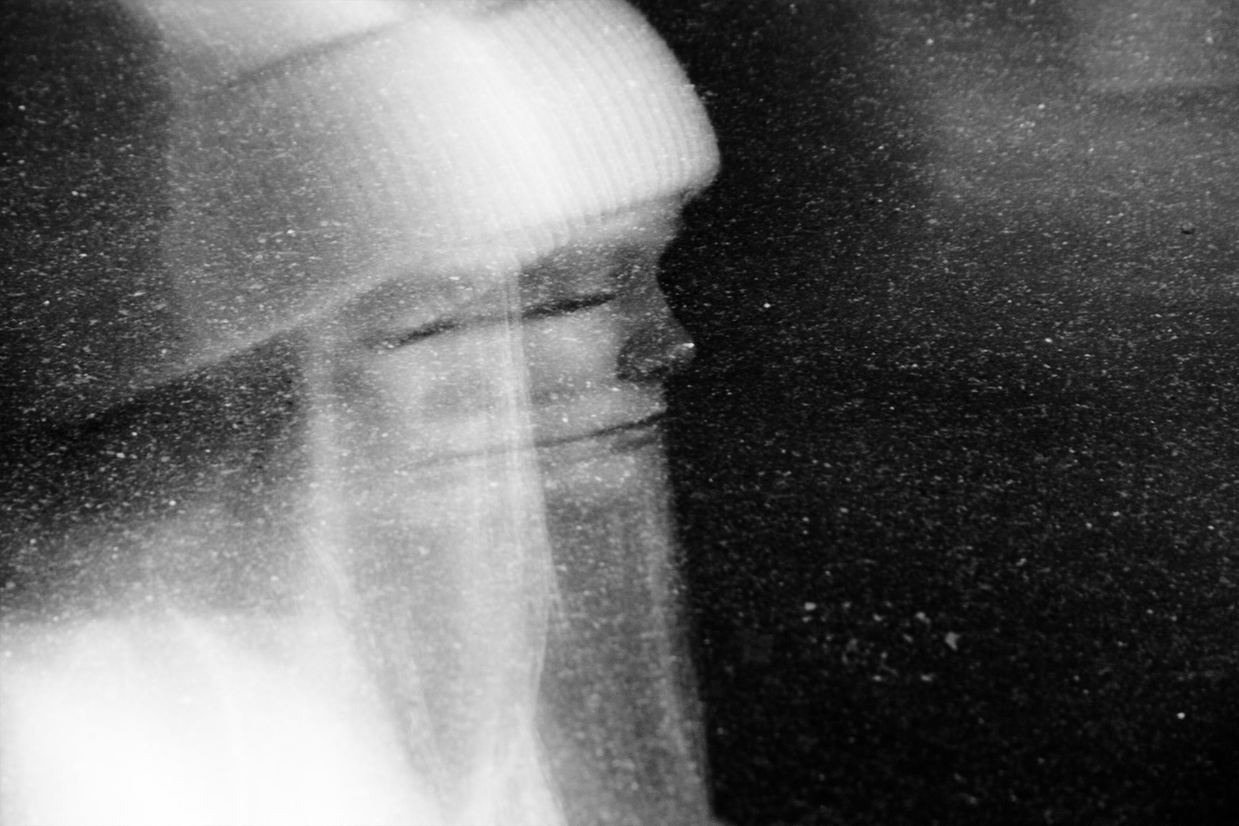 "Lost In Space" street portrait with cosmic, weightless feel as if walking in space. In-camera double exposure. Shot in Helsinki, Finland by Oscar Wollsten.