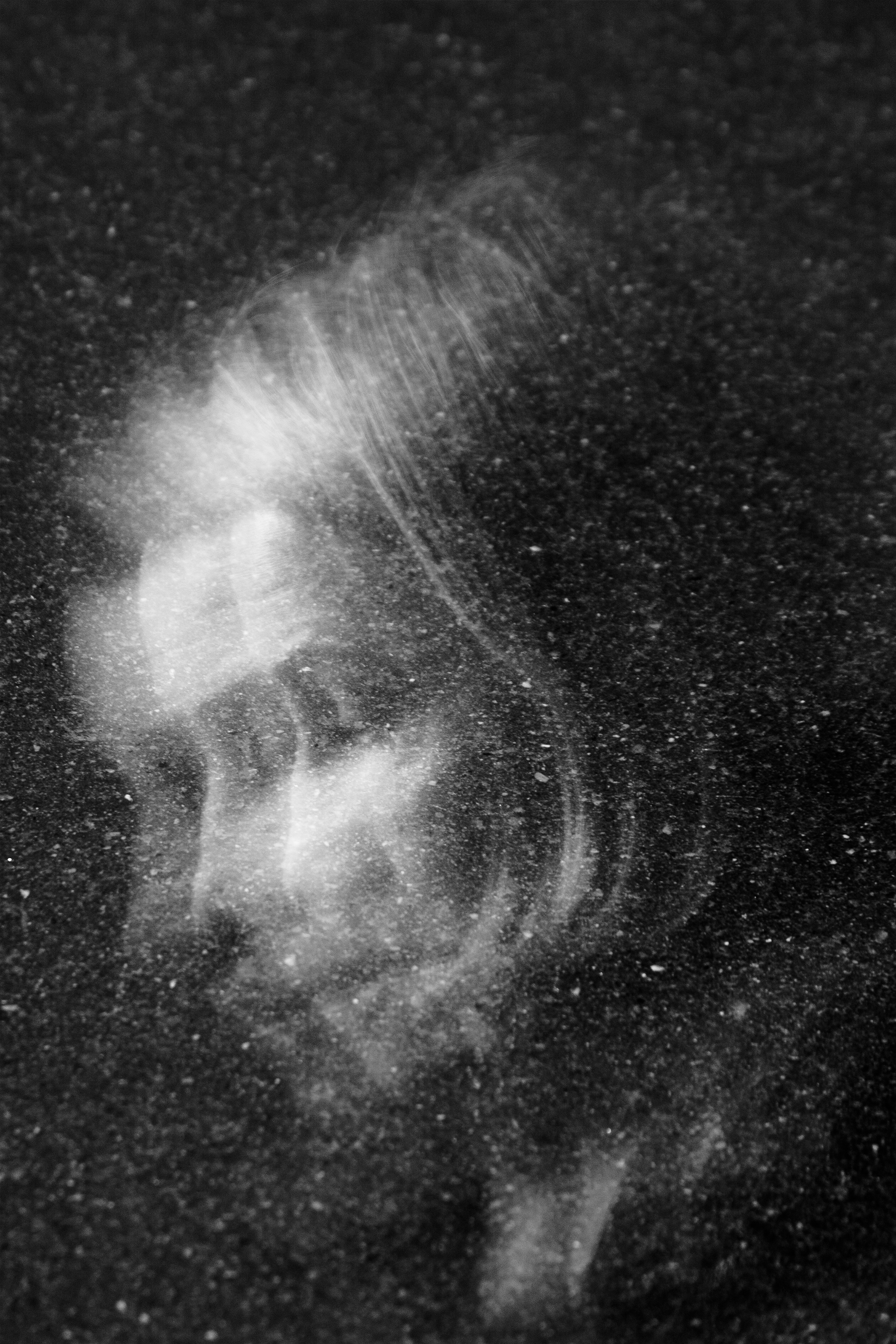 "Lost In Space" street portrait with cosmic, weightless feel as if walking in space. In-camera double exposure. Shot in Helsinki, Finland by Oscar Wollsten.