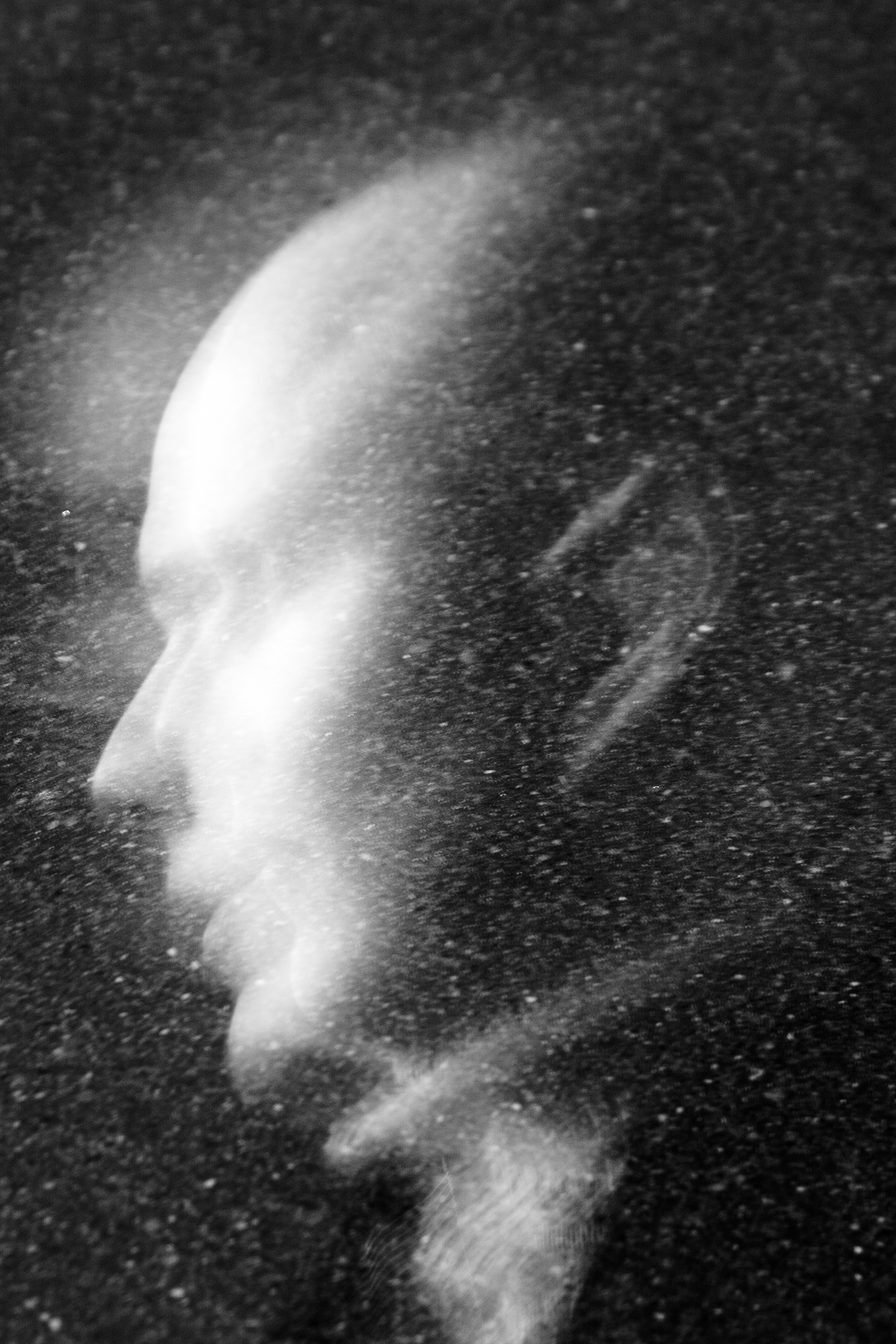 "Lost In Space" street portrait with cosmic, weightless feel as if walking in space. In-camera double exposure. Shot in Helsinki, Finland by Oscar Wollsten.