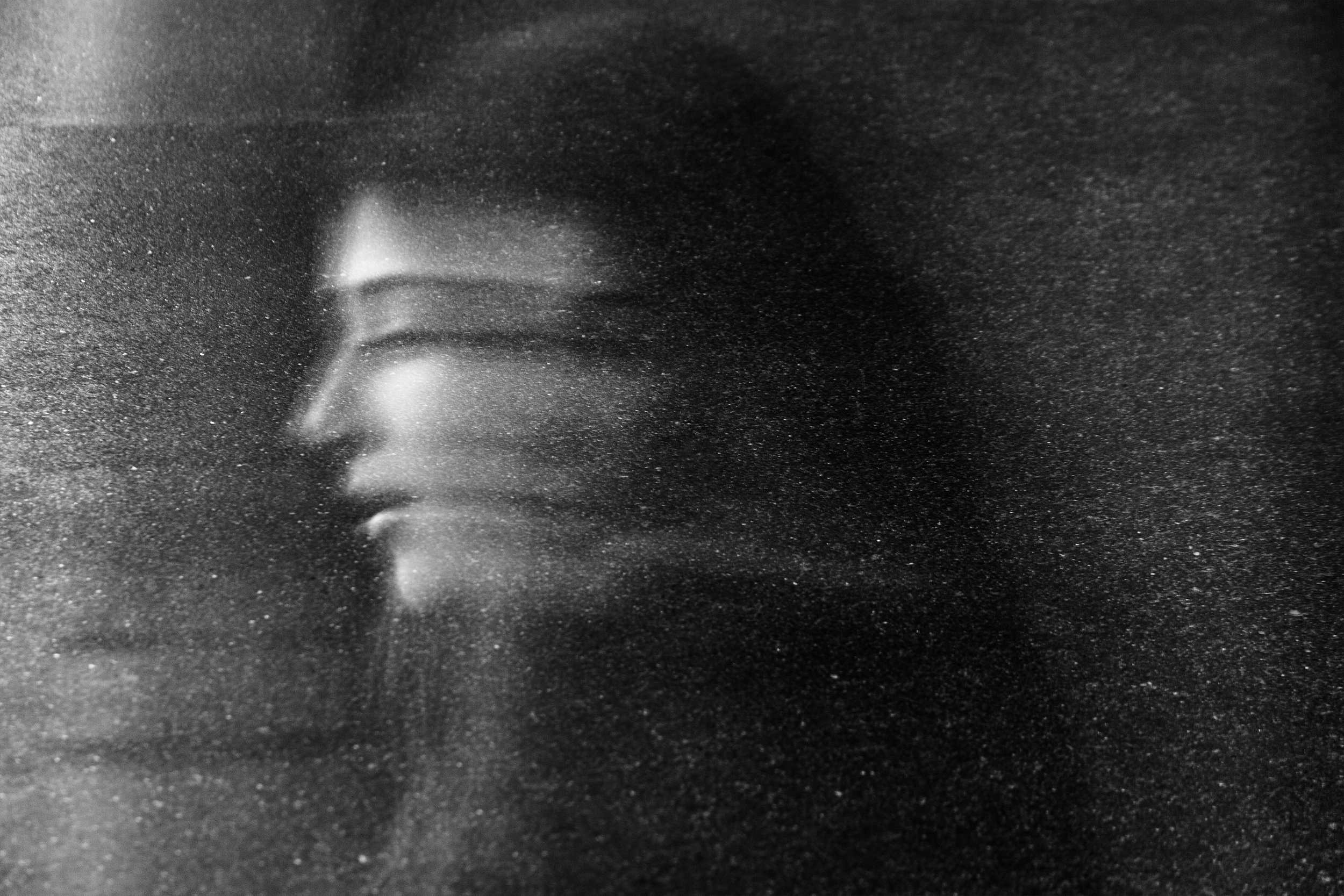 "Lost In Space" street portrait with cosmic, weightless feel as if walking in space. In-camera double exposure. Shot in Helsinki, Finland by Oscar Wollsten.