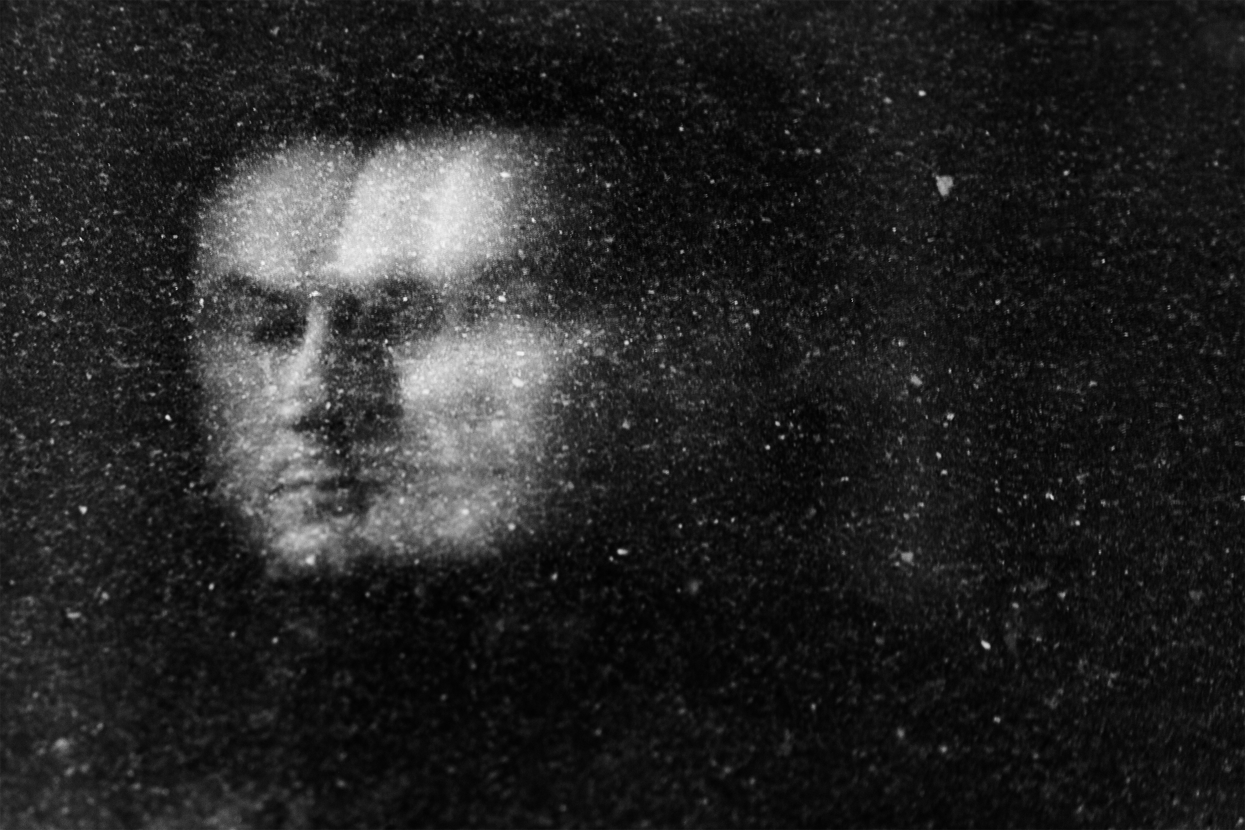 "Lost In Space" street portrait with cosmic, weightless feel as if walking in space. In-camera double exposure. Shot in Helsinki, Finland by Oscar Wollsten.