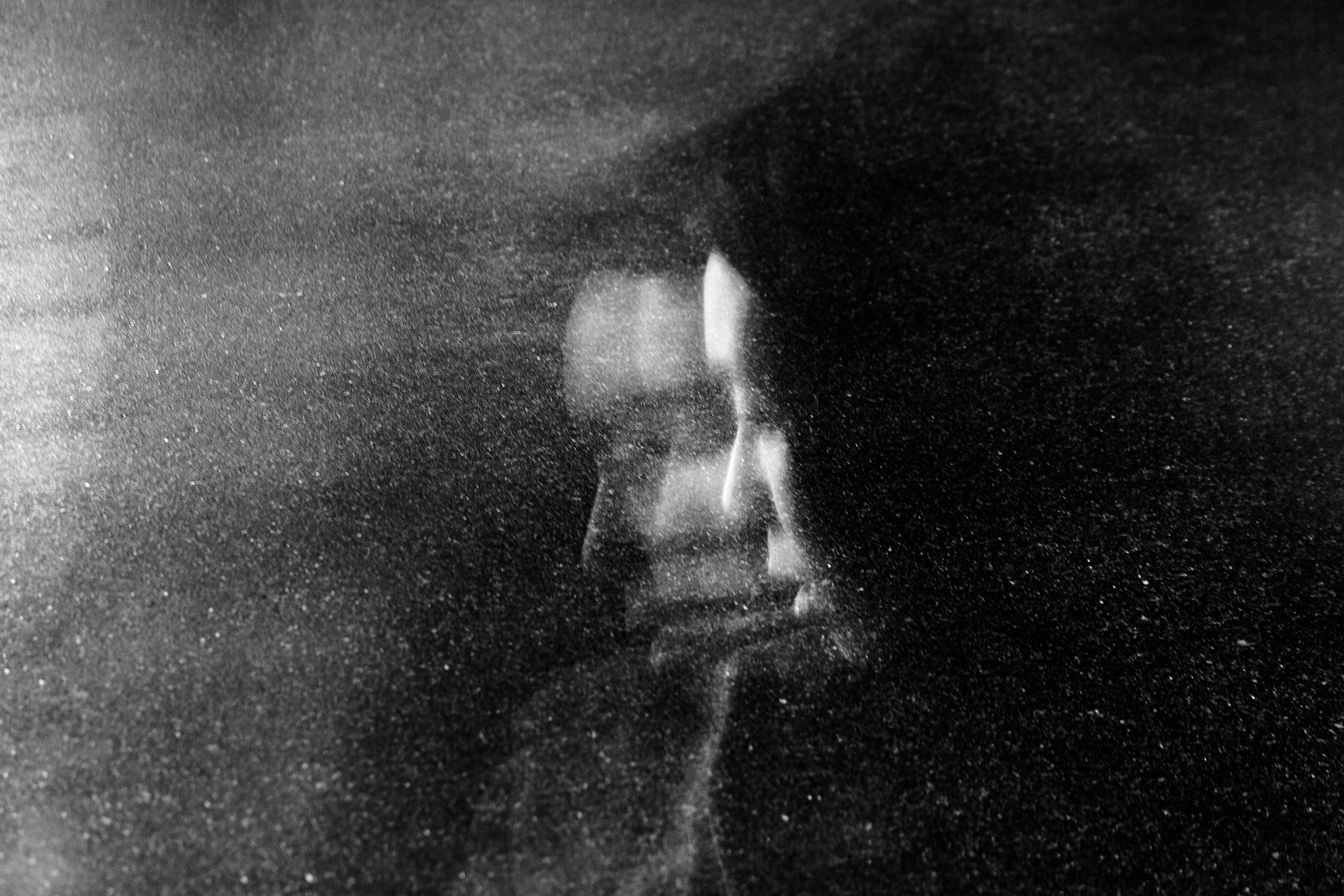 "Lost In Space" street portrait with cosmic, weightless feel as if walking in space. In-camera double exposure. Shot in Helsinki, Finland by Oscar Wollsten.