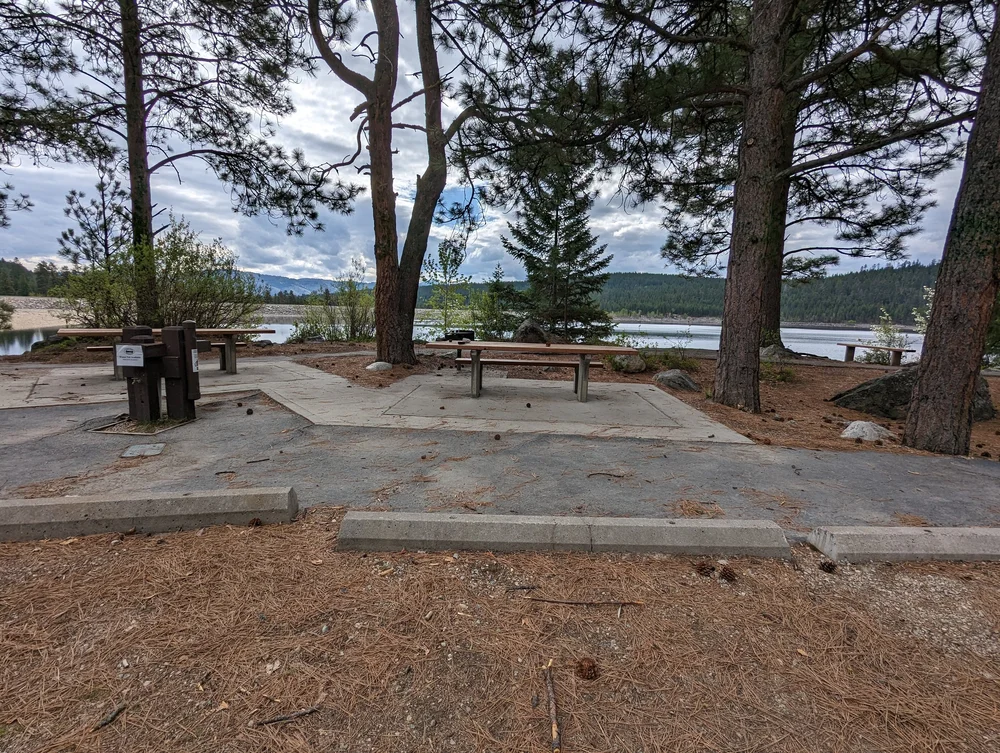  A curb blocking the parking lot from the picnic site 