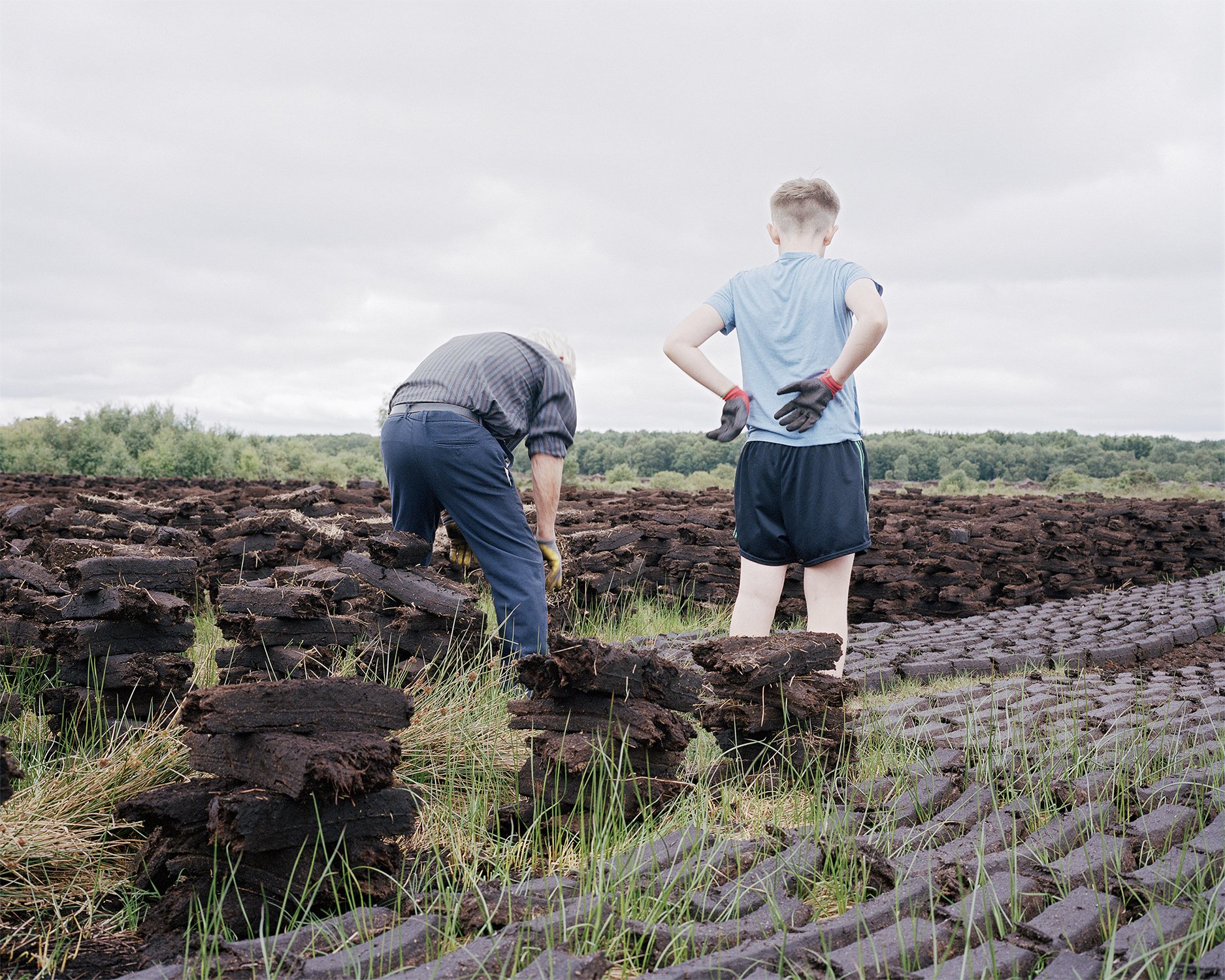 John and Josh footing turf for domestic use, Knockirr Bog, County Kildare, 2019.