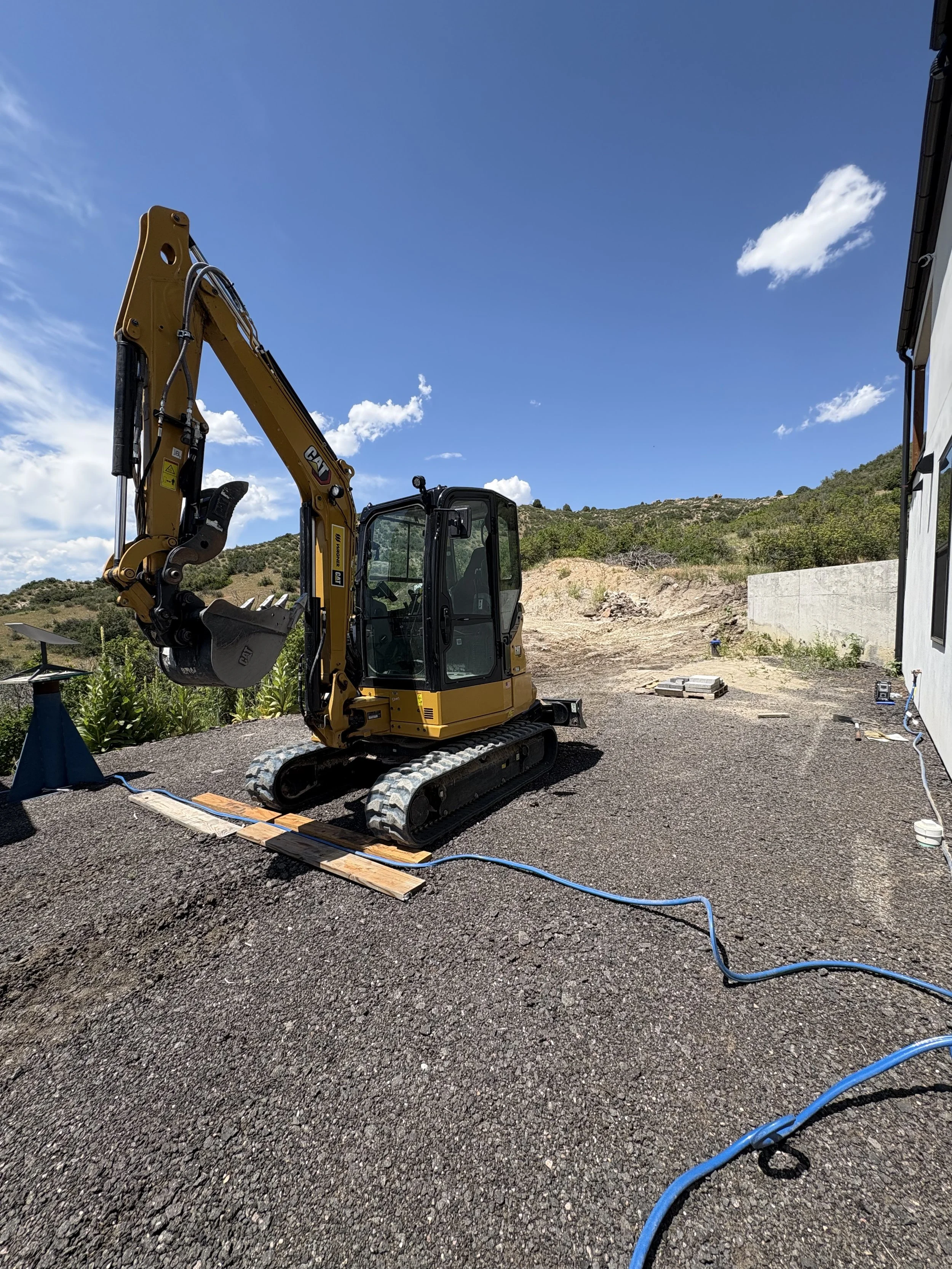 Gotta always keep tabs on the water line to the trailer! We are quite used to creating a "boardwalk" for the construction rigs to safely pass.
