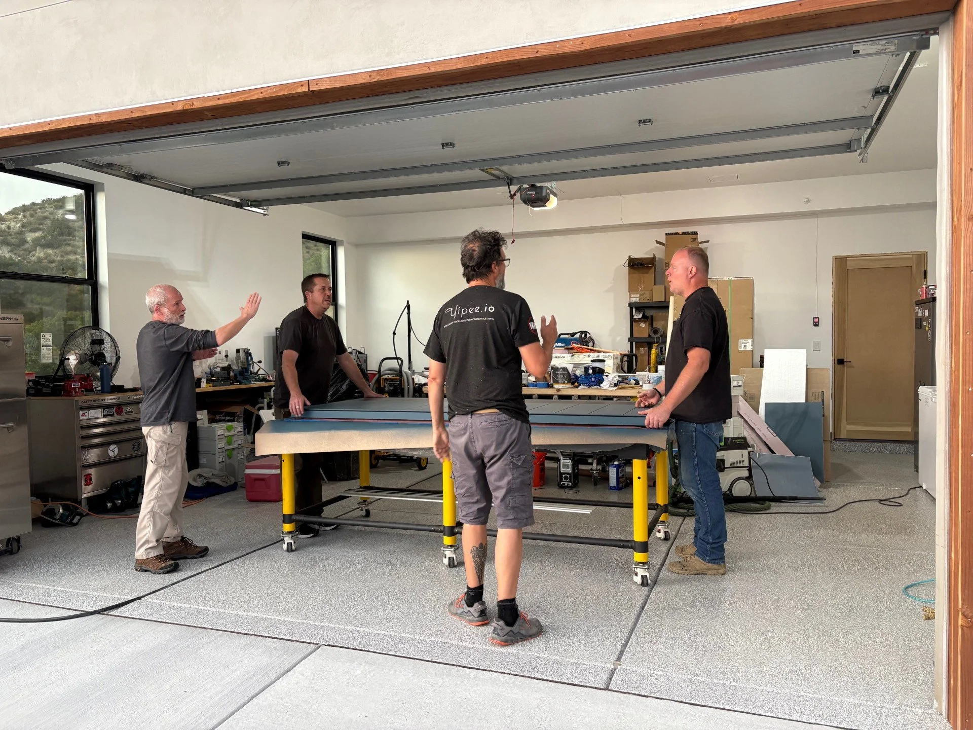 Now the final step! Installation! This door is a beast! It'll take 4 guys to carry the door over.