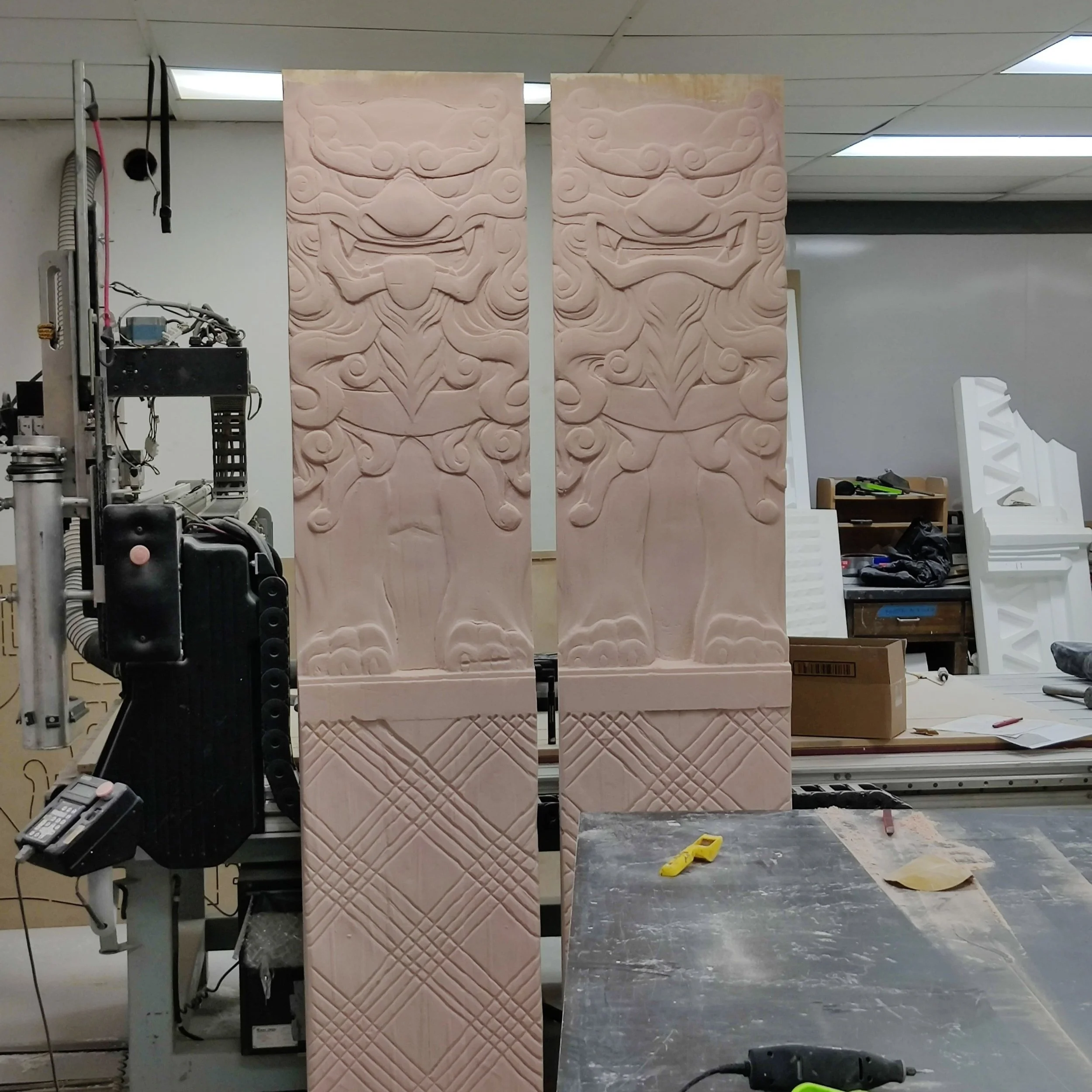 Shisa door guardians designed, digitally sculpted and toolpathed. Carved from HDU