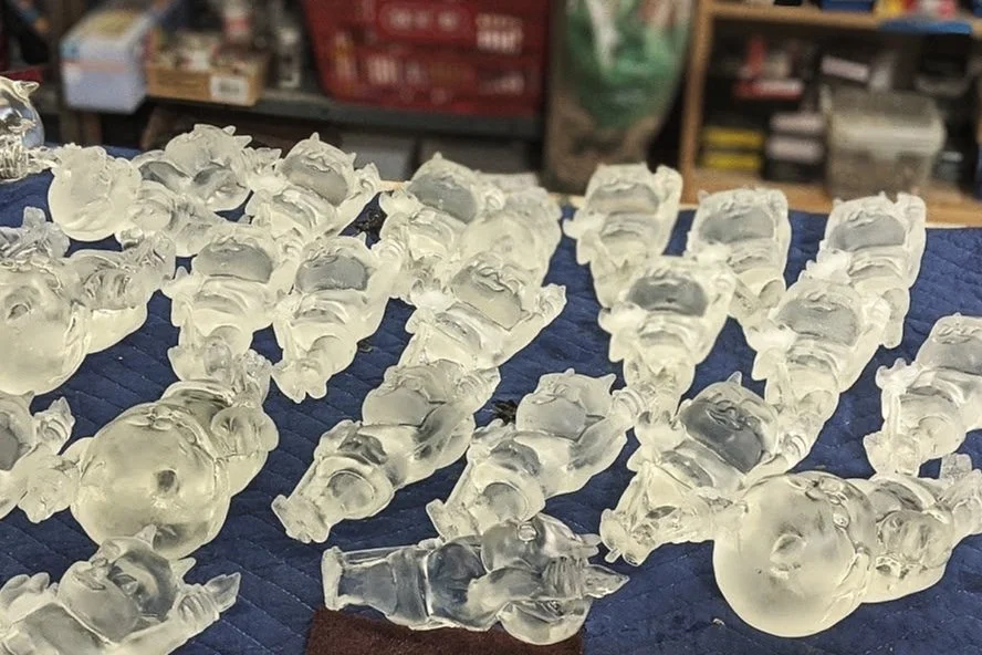 Statuettes were cast in clear resin. Casts of both sizes were prepped for clear coat