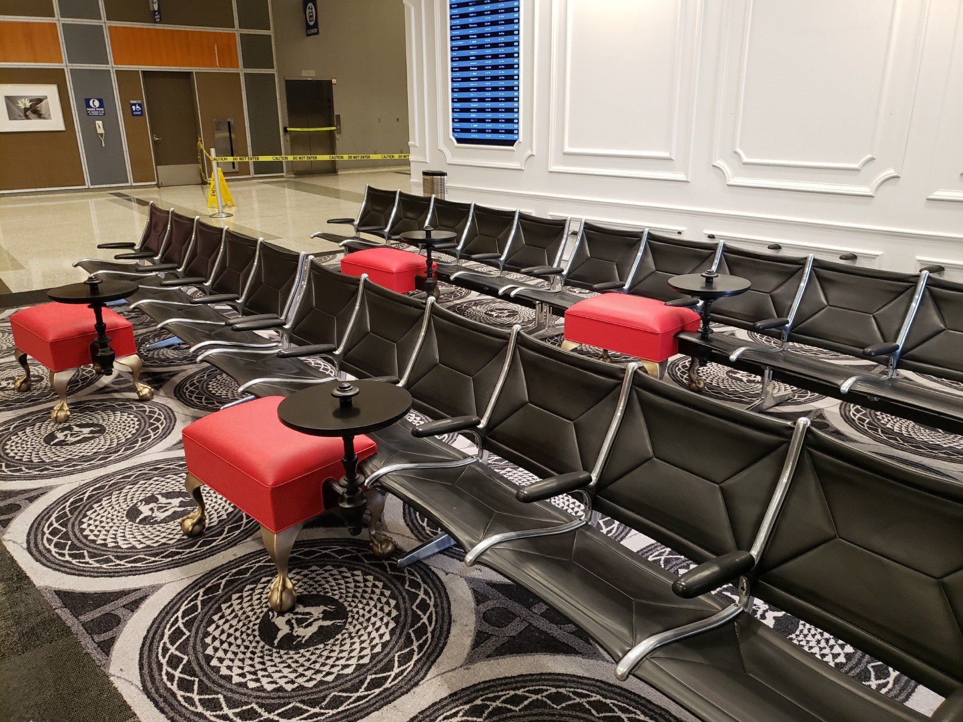 Final installation with custom ottomans intersecting airport benches