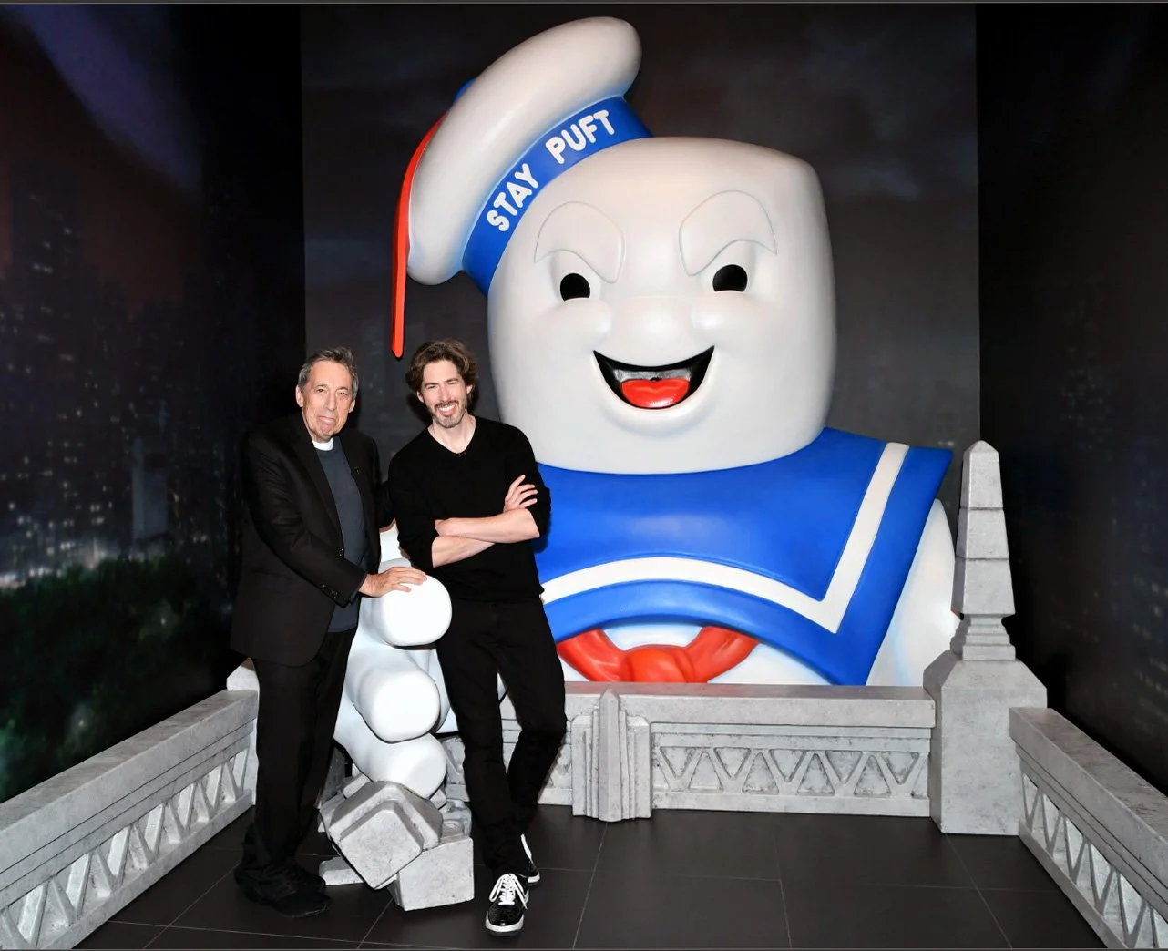 Ghostbusters directors Jason and Ivan Reitman in front of the final installation