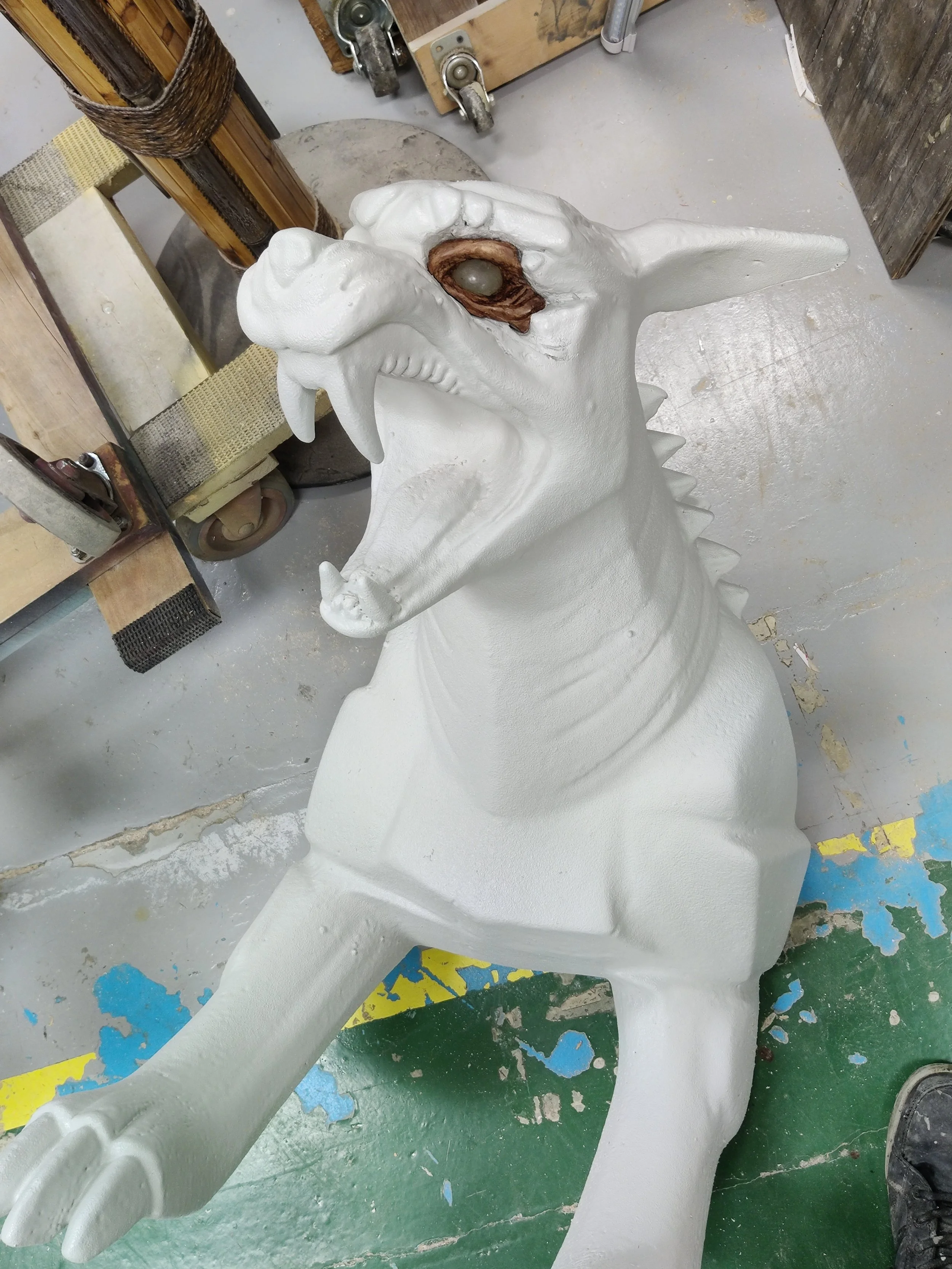 painted eye breaking out of stone (foam) encasement