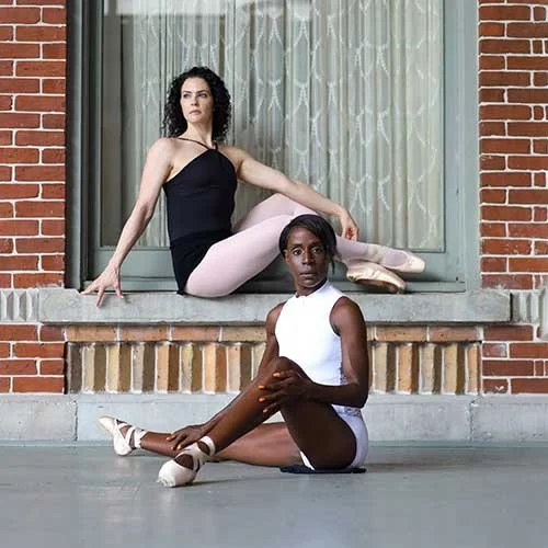Margarette Allyn in ballet attire seated alongside another dancer