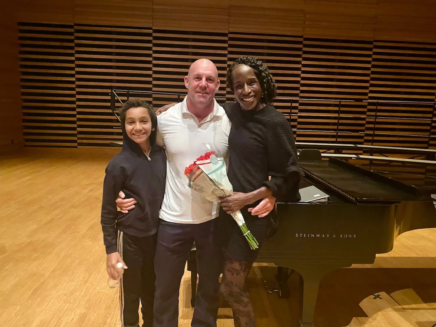 Margarette celebrating with family after performing with the Master Chorale of Tampa Bay's Summer Chorus.