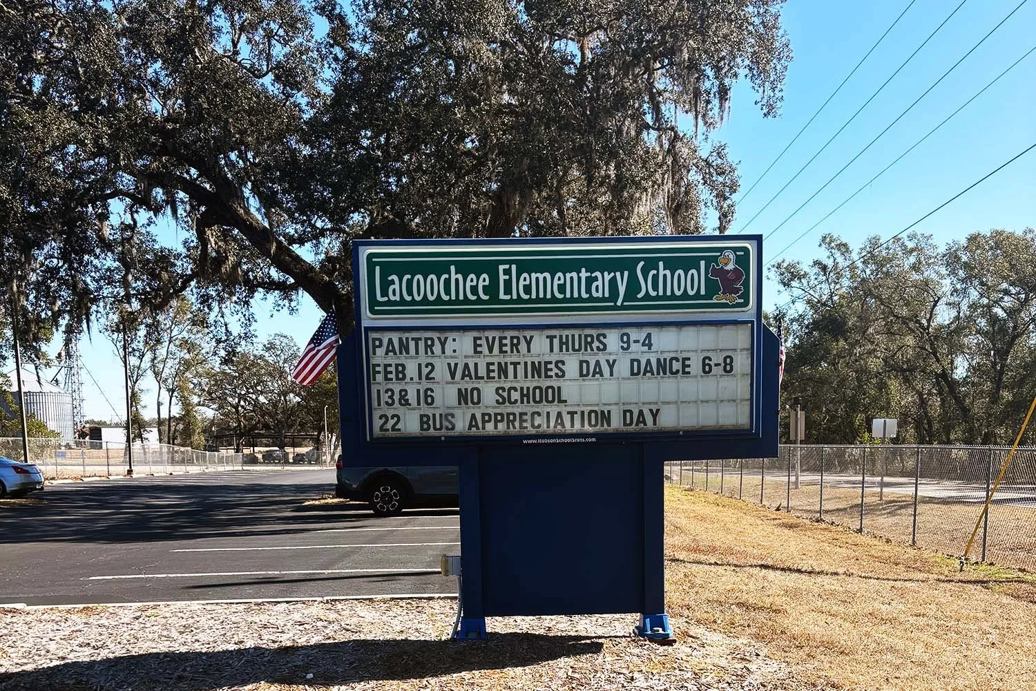 Lacoochee Elementary School sign in Dade City, Florida, surrounded by Spanish moss oak trees