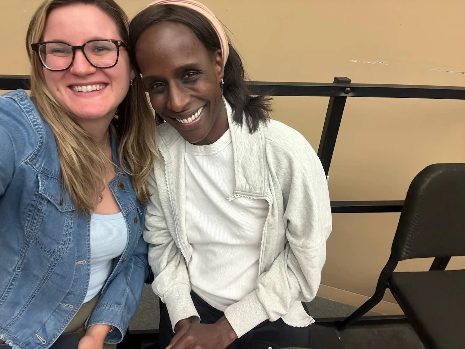 Margarette and Savannah smiling together before a Master Chorale of Tampa Bay Summer Chorus rehearsal.
