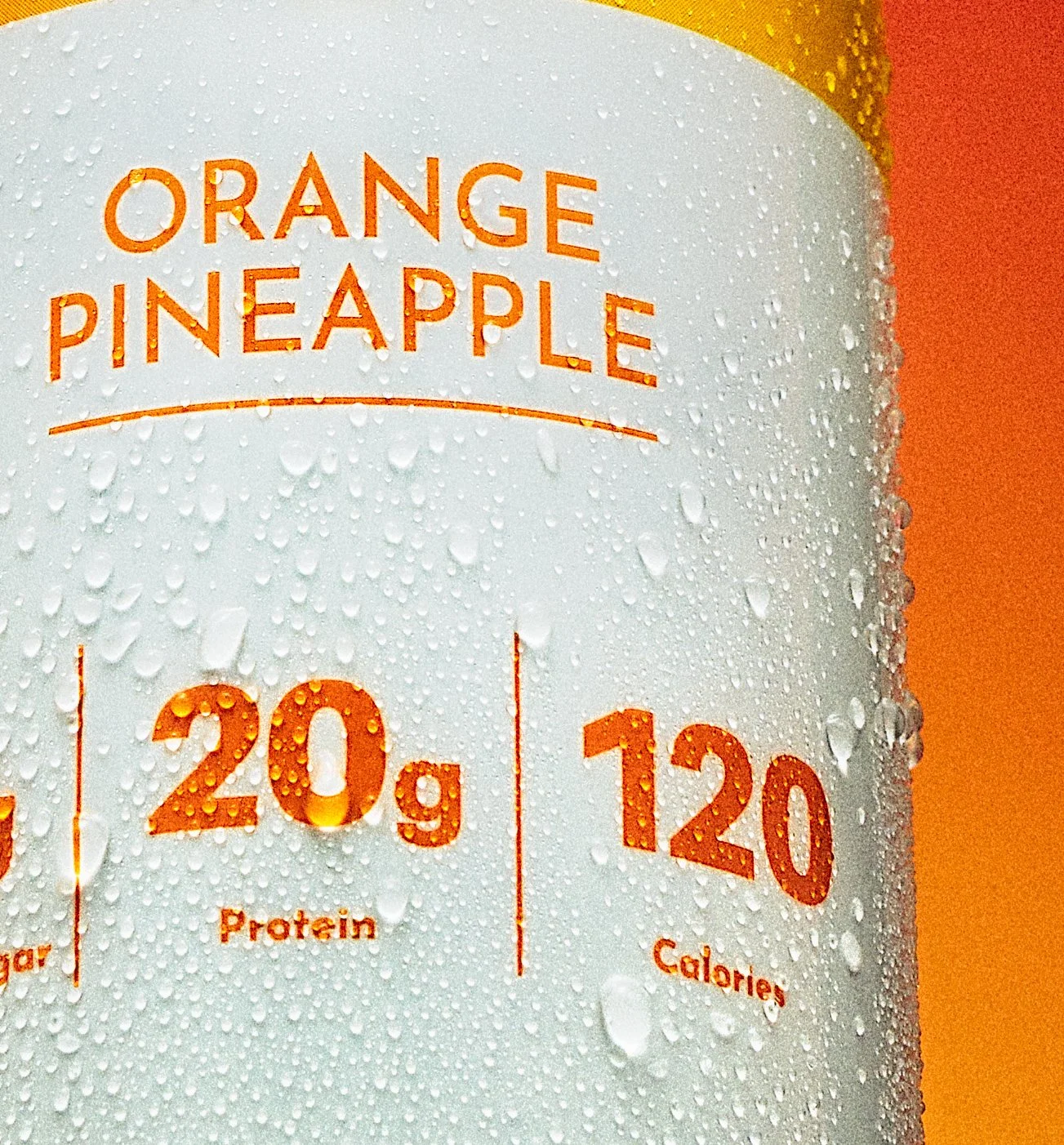 Sharp macro close-up by NAJ Captured of the 20g protein and 120-calorie callouts on a Just Ingredients Clear Protein can.