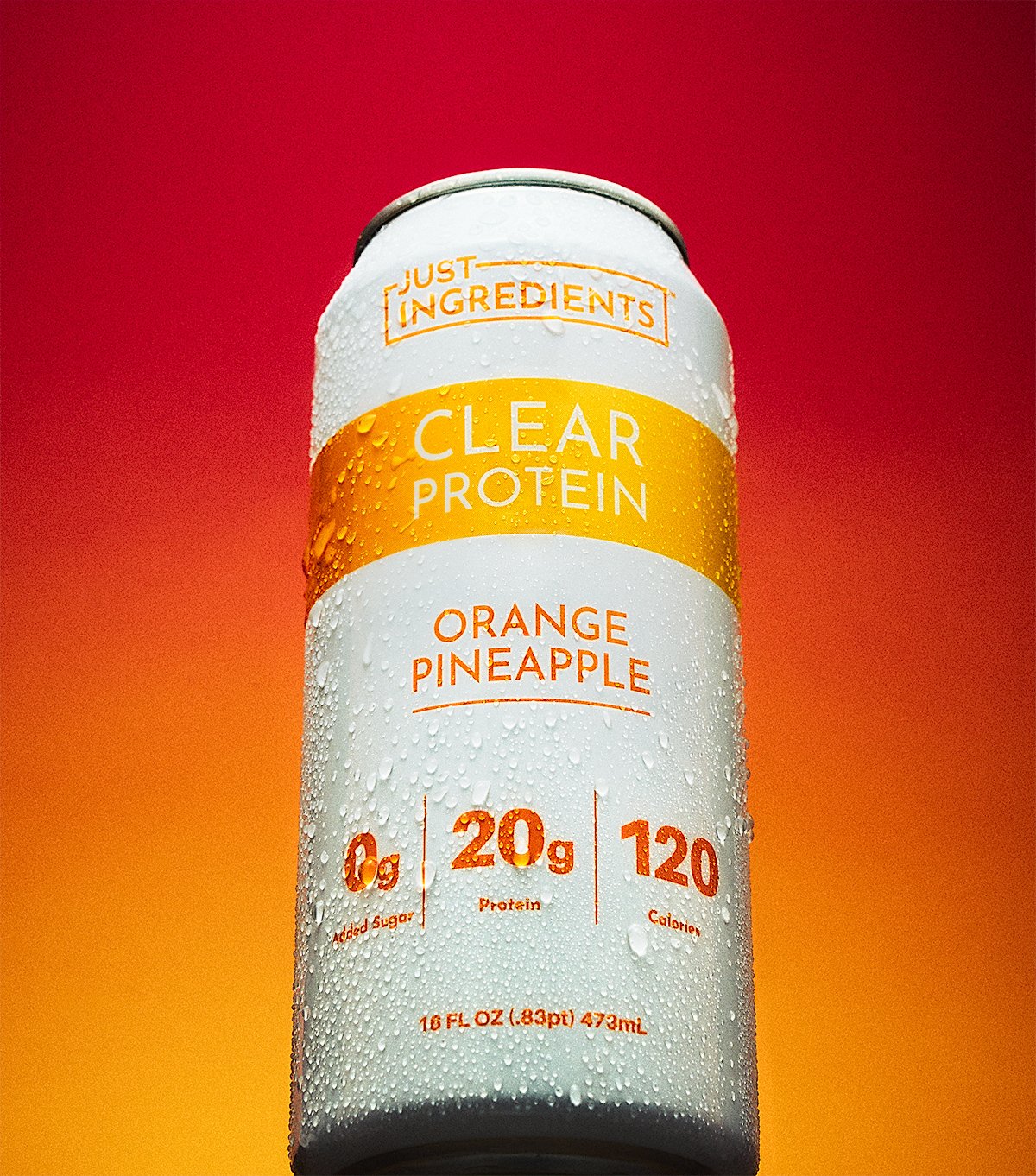 NAJ Captured product photo of a Just Ingredients Clear Protein Orange Pineapple can with condensation, showing 0g added sugar, 20g protein, and 120 calories.