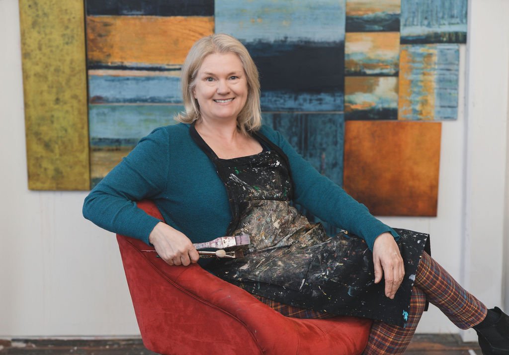 Heather sideways seated with brushes 2024.jpg