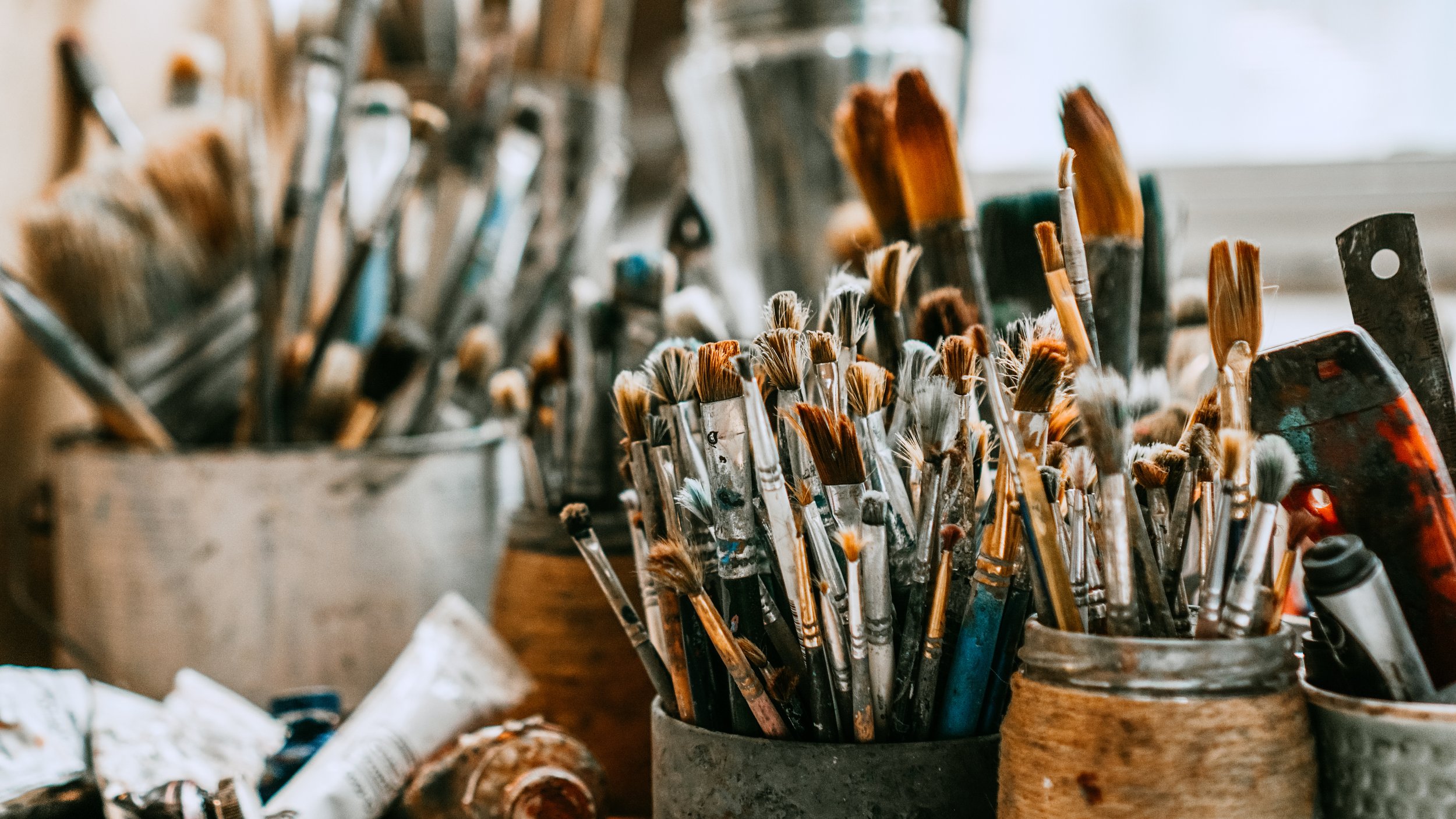 brushes in cans.jpeg