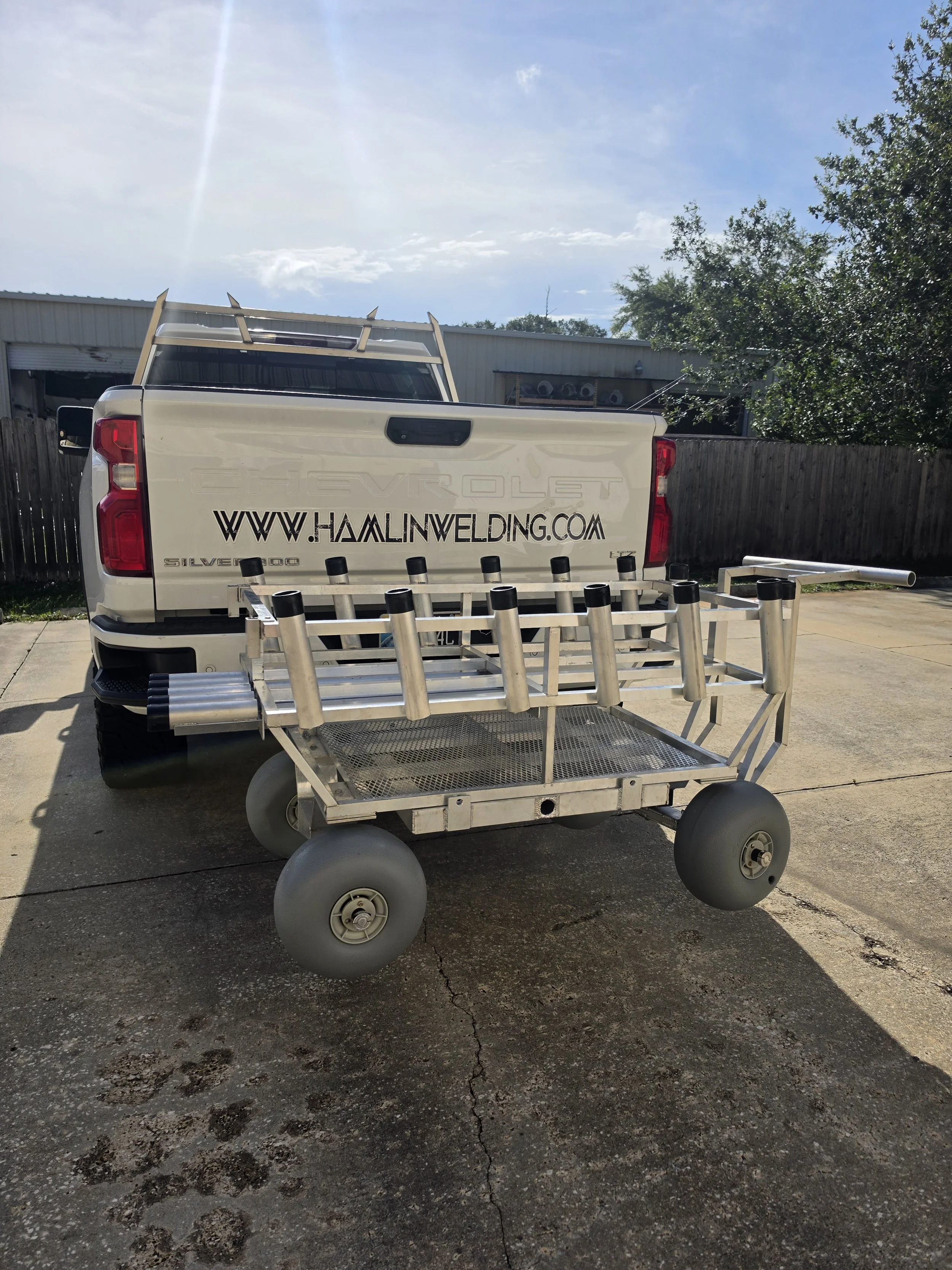 Loads onto a 2" receiver in under a minute, fully rigged. Custom beach fishing cart mounted to a truck trailer hitch receiver