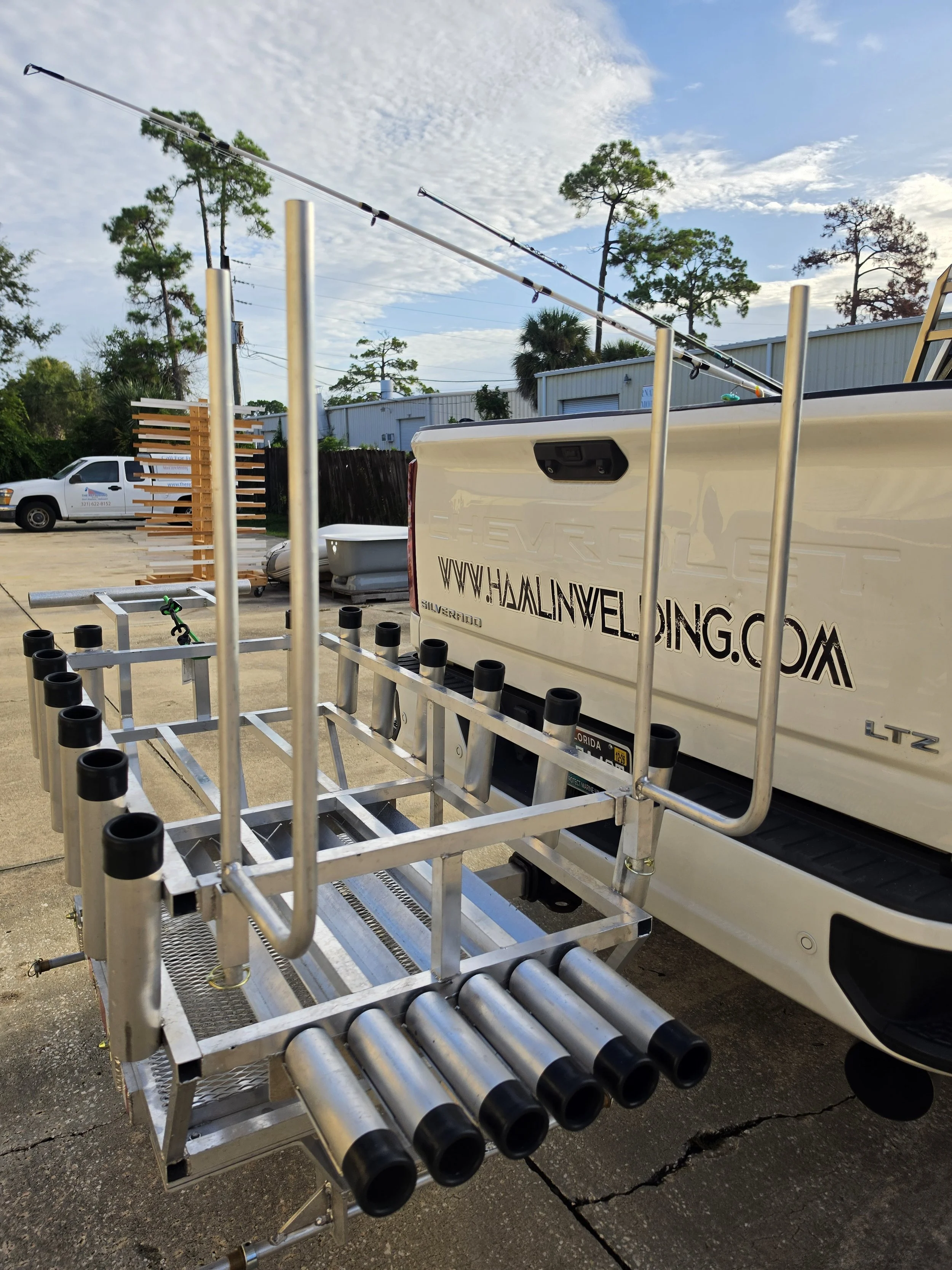 Chair arms mount to the frame and stay out of the way when you don't need them. Aluminum chair rack arms mounted to a custom surf fishing cart frame