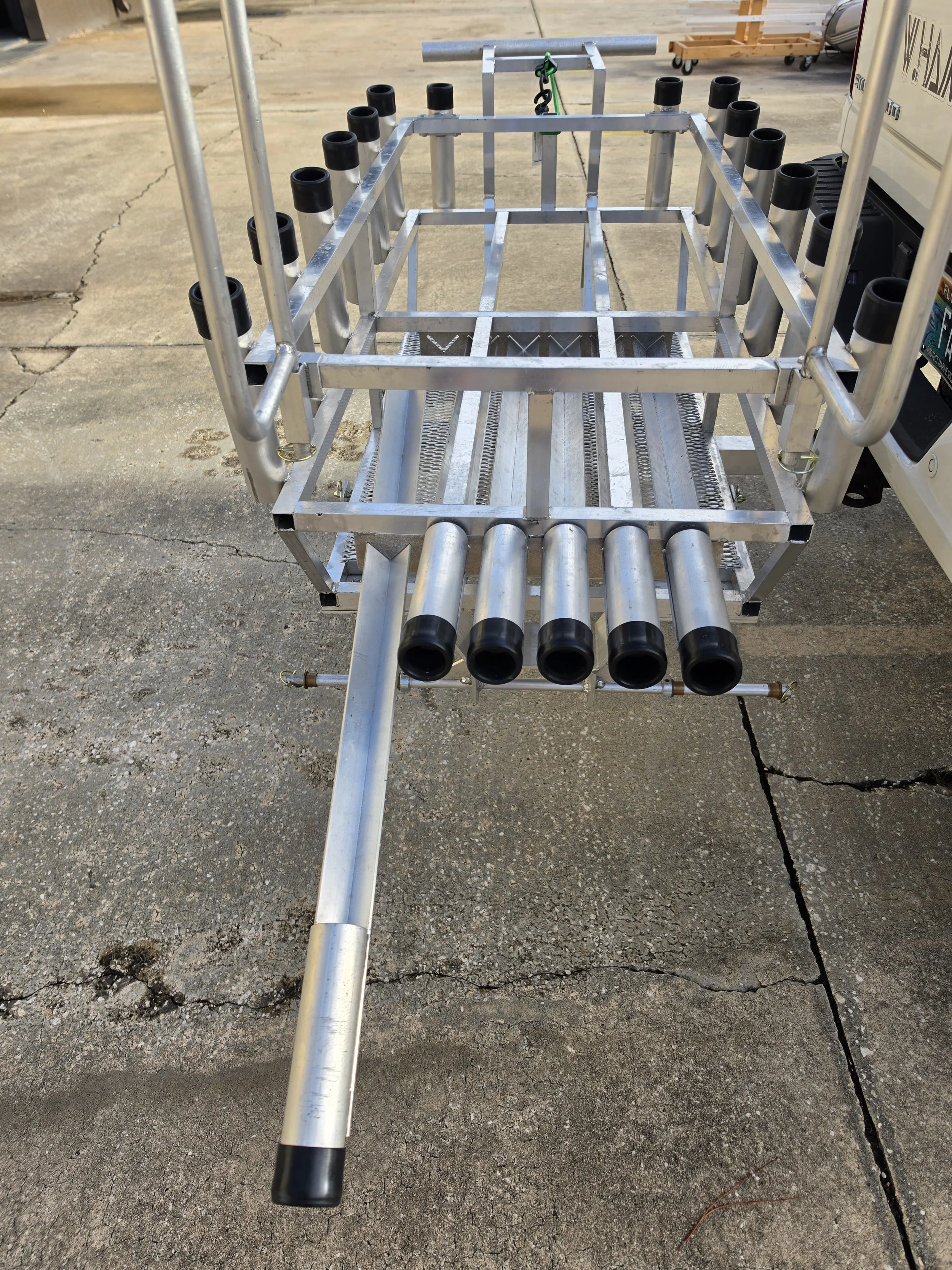 Angled sand spike storage rack on a custom beach fishing cart