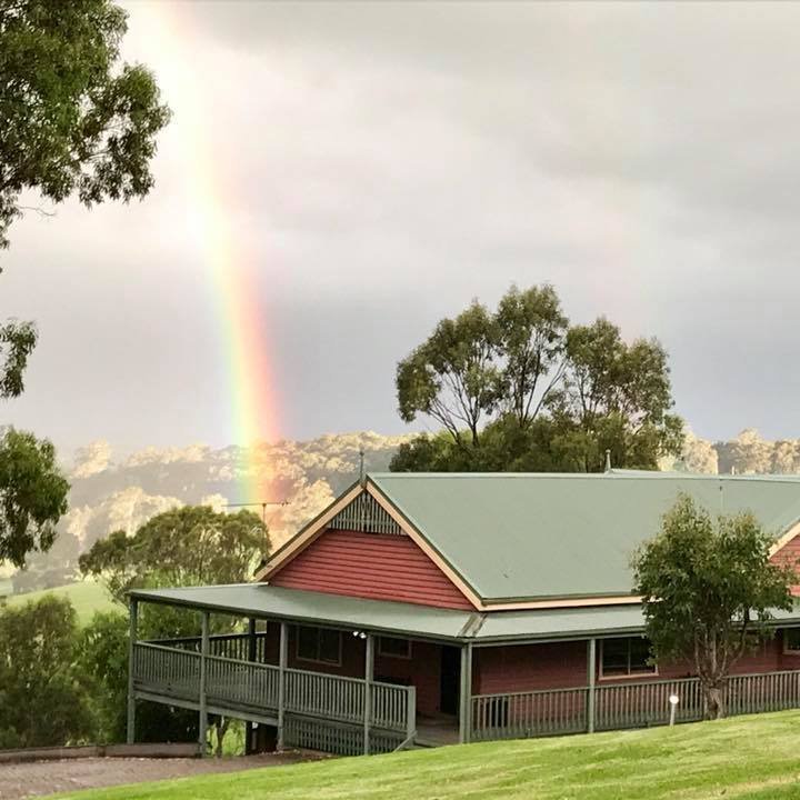 The original Bryn exterior (pre-2023) featuring a Central Tilba rainbow