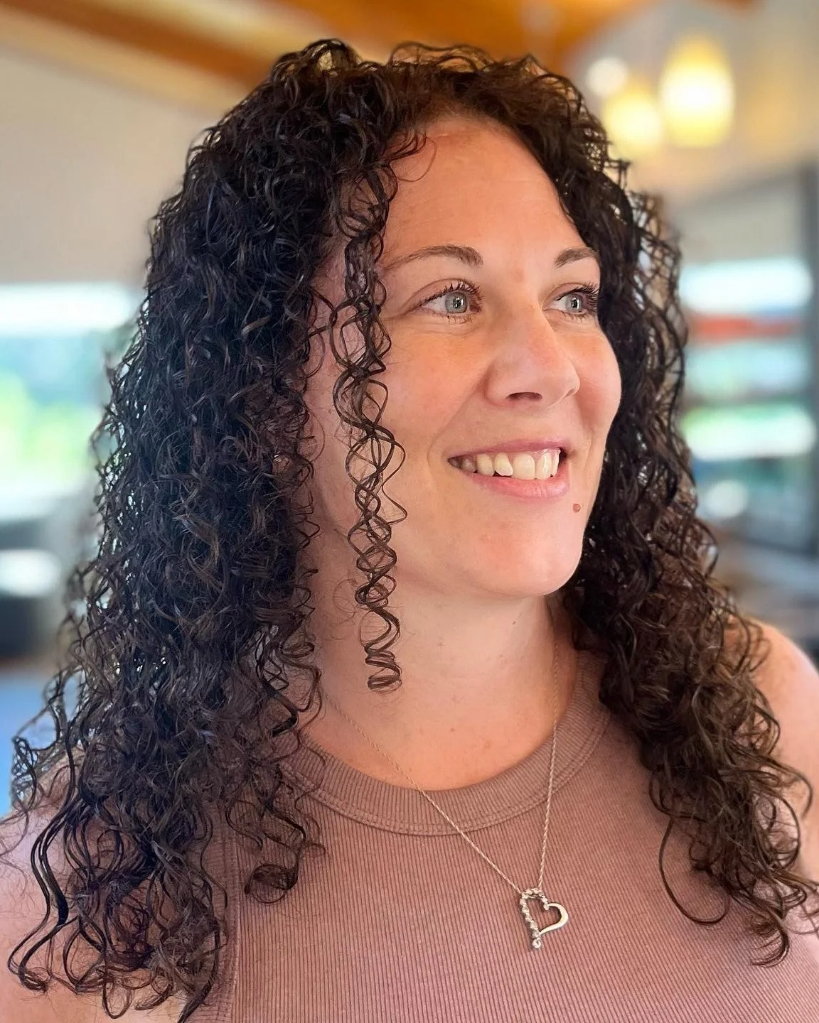 After a box-dye mishap, this client came in with uneven color and green creeping into the ends. Our stylist Terri @i.play.with.hair gave her a beautiful color correction back to a deep, natural brown &mdash; and enjoyed the fun bonus of getting to wo