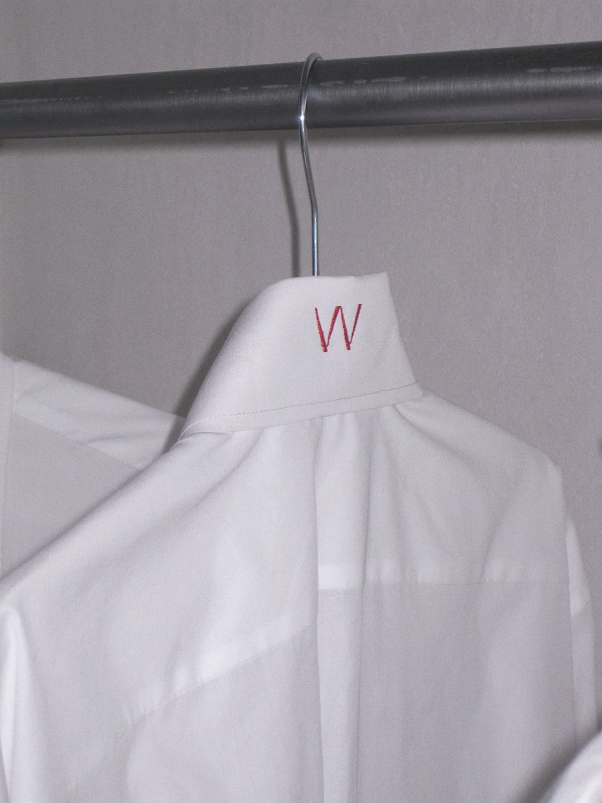 woera white shirt with the red W embroidered on the collar, made in Athens