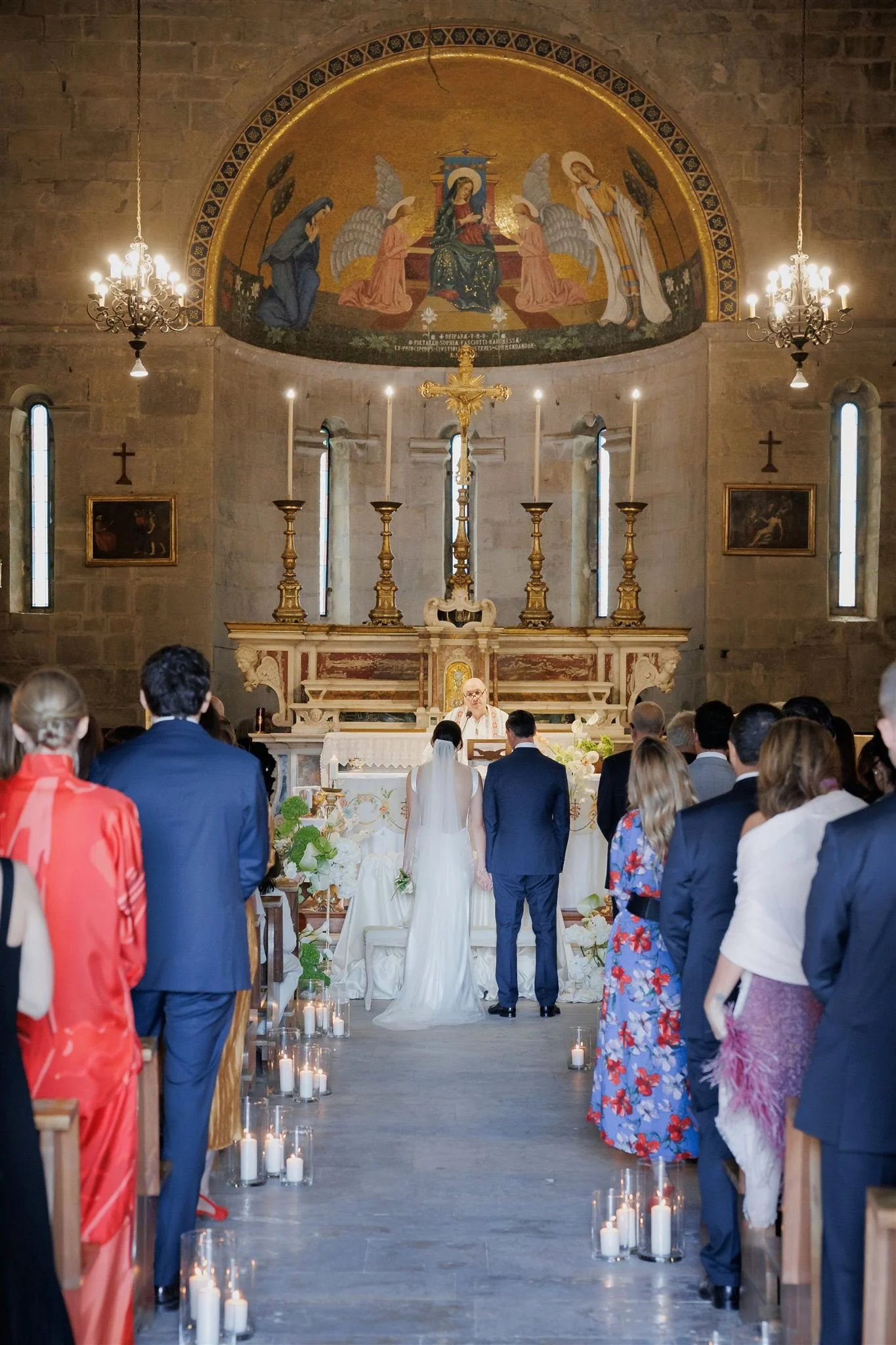 Church aisle decorated with candles