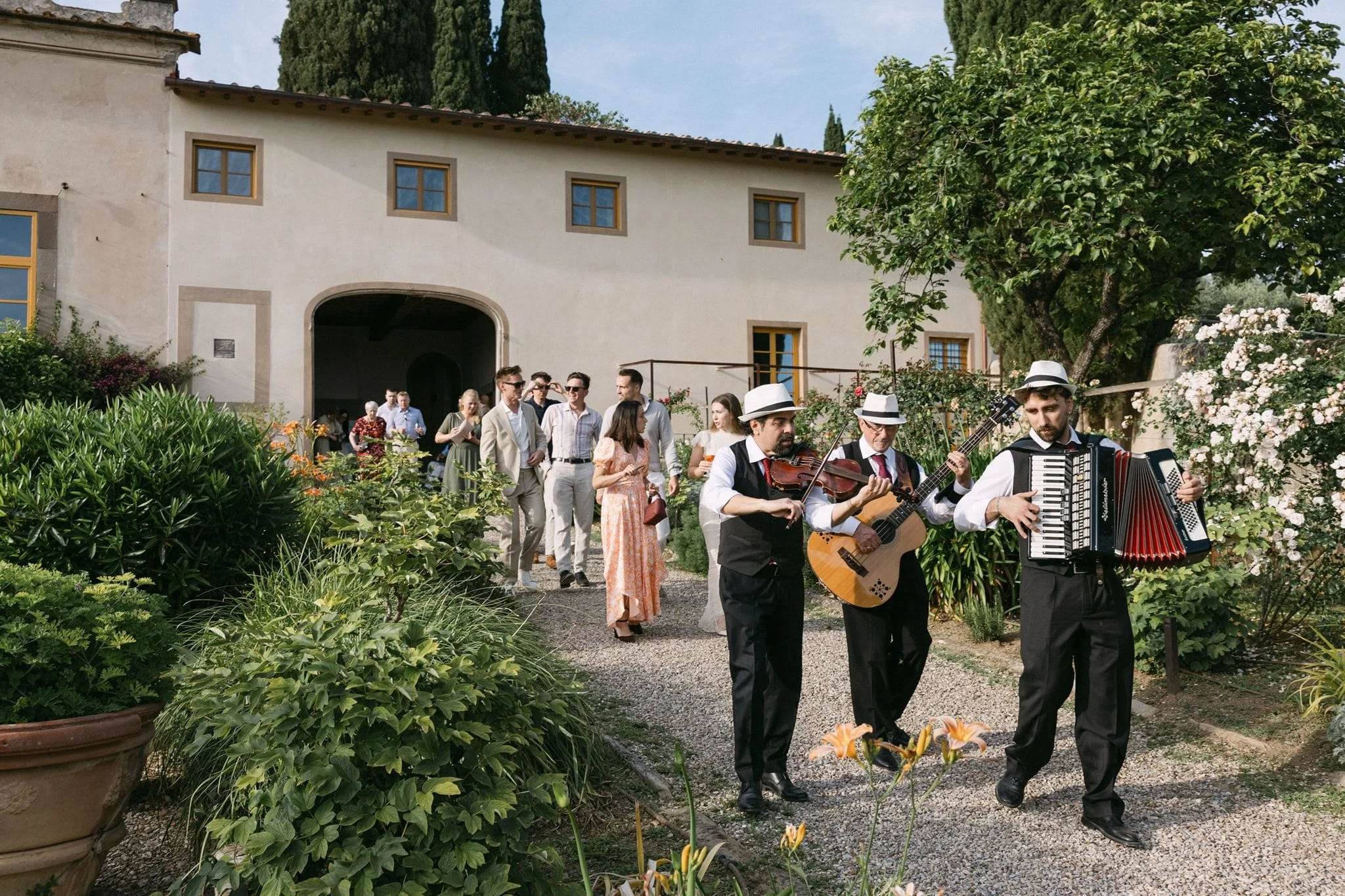 Italian music trio performing at a wedding welcome party