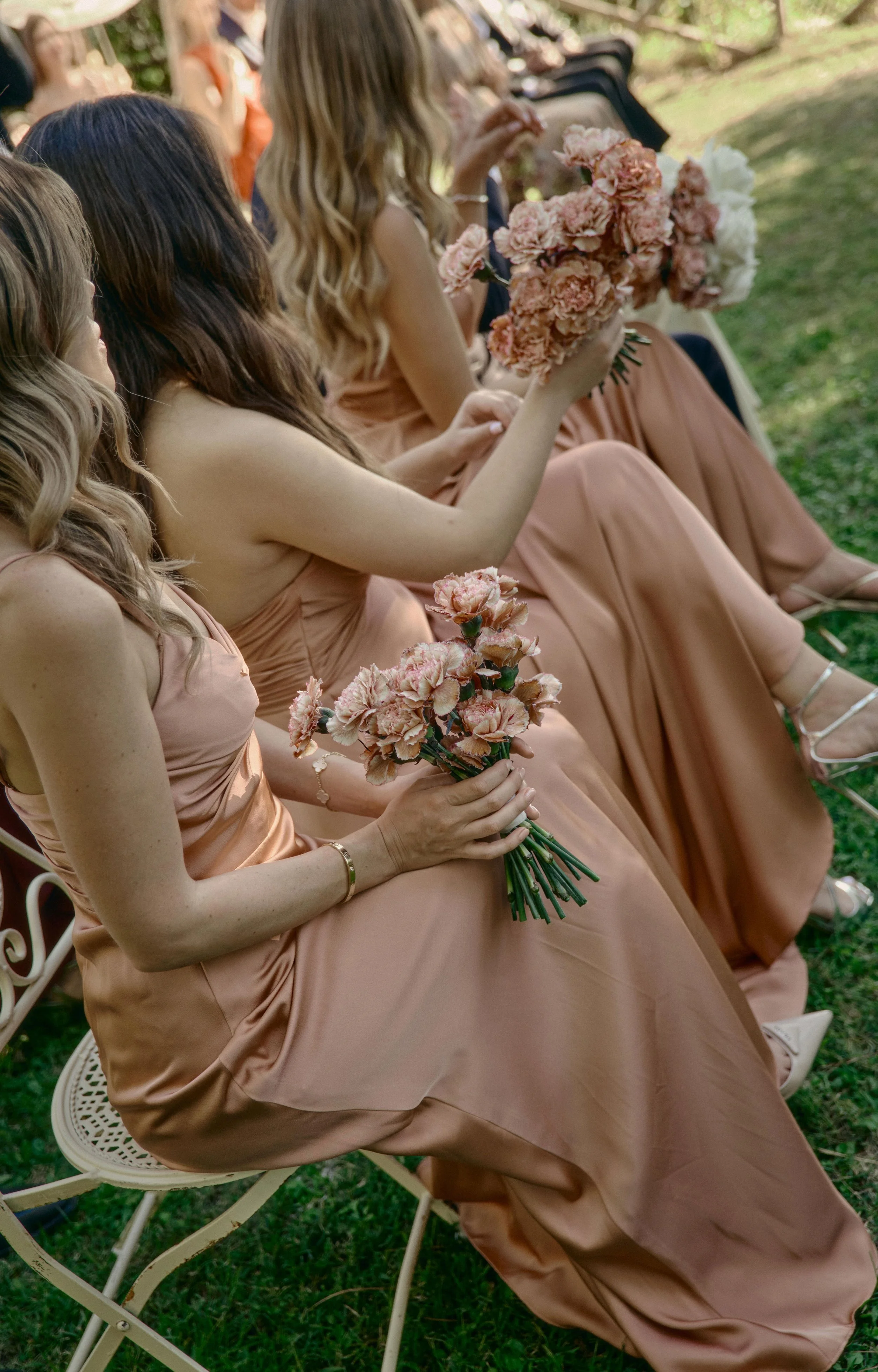 Dark pink bridesmaids with pink bouquet