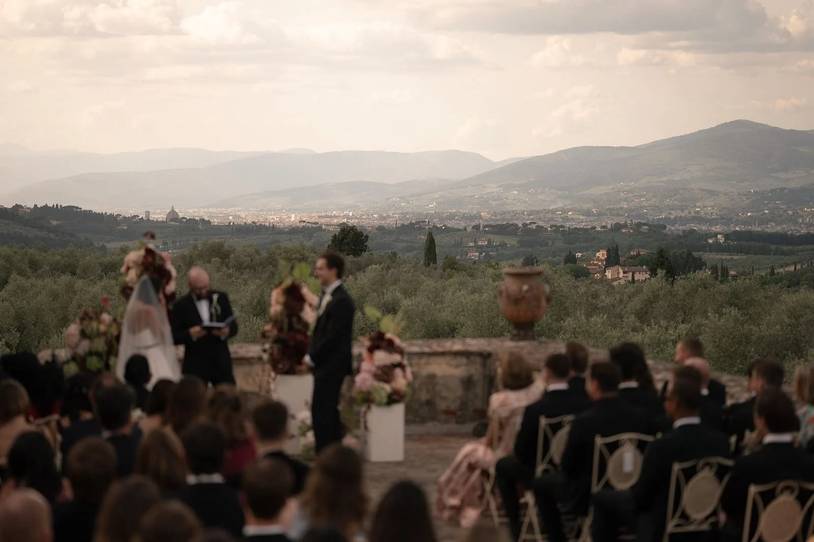Burgundy and white floral ceremony decoration at Villa Medicea di Lilliano