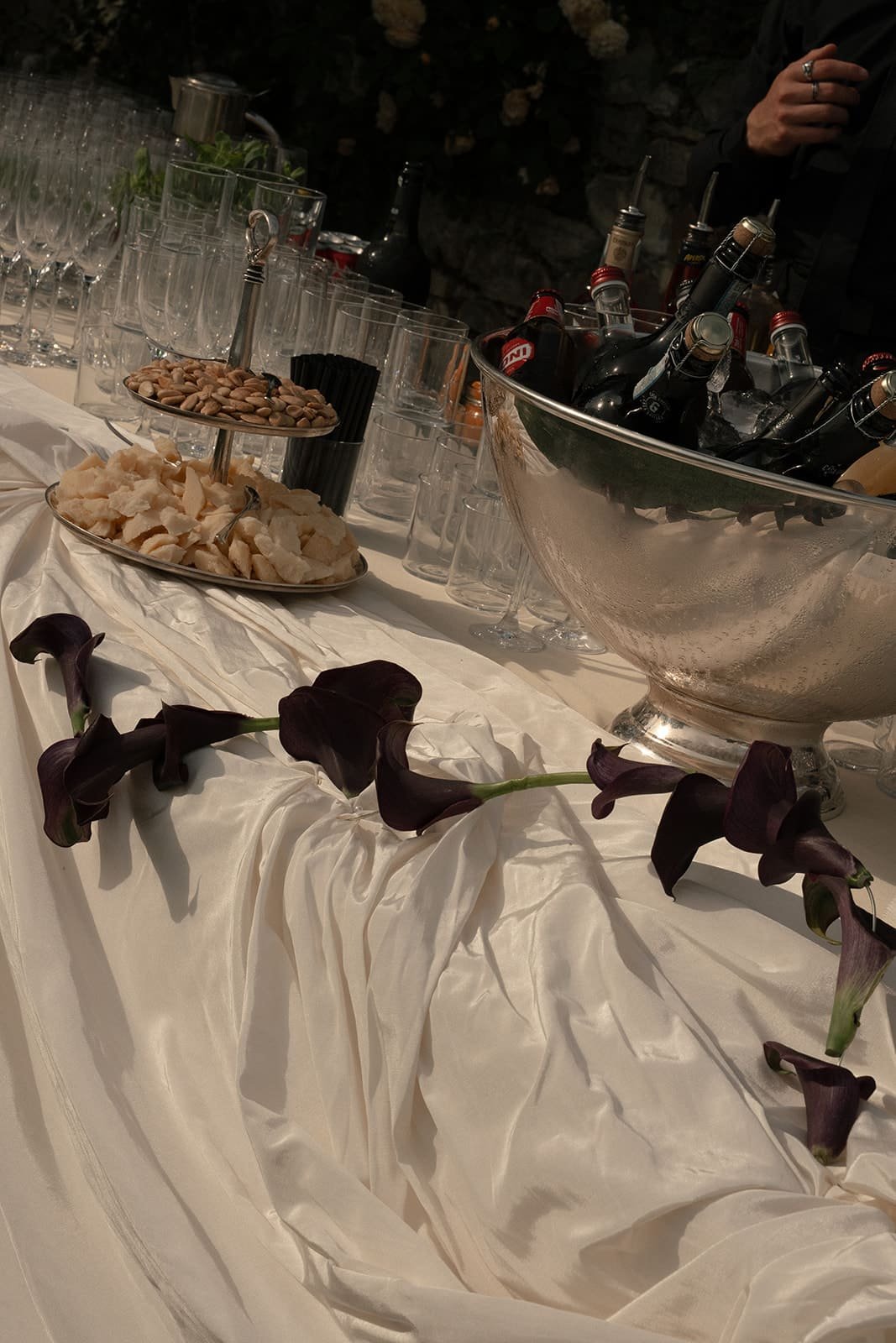 Draped buffet table with burgundy calla lilies