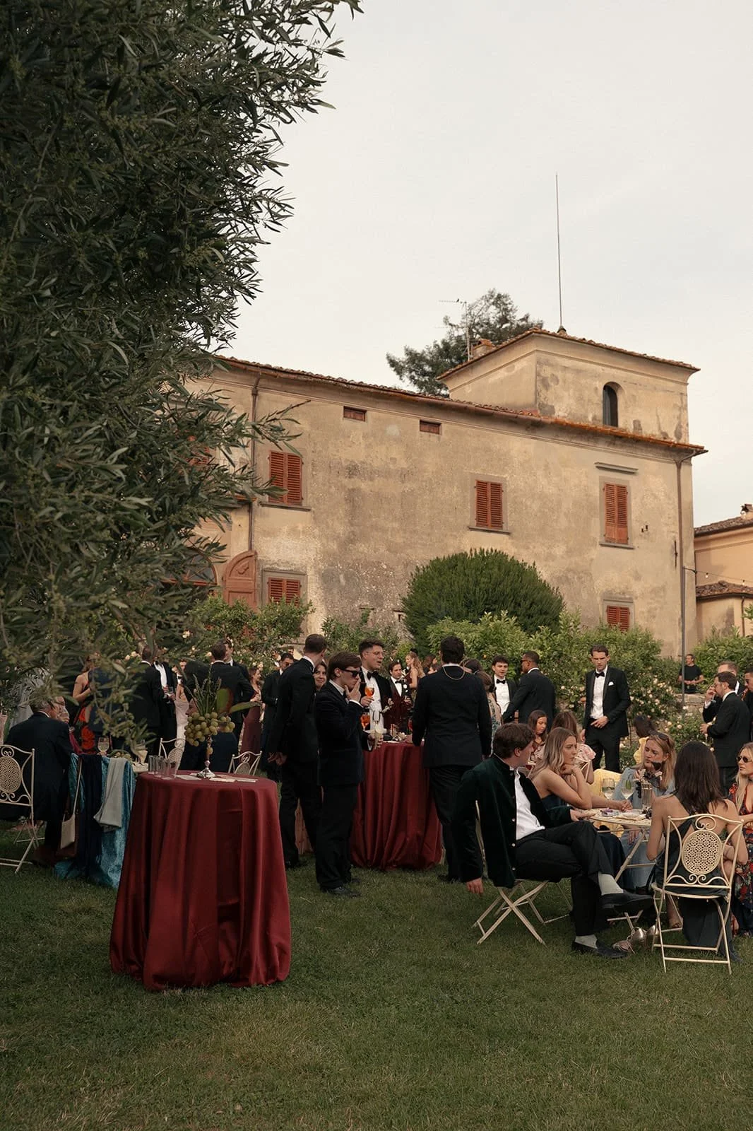 Romantic outdoor cocktail reception surrounded by Tuscan gardens
