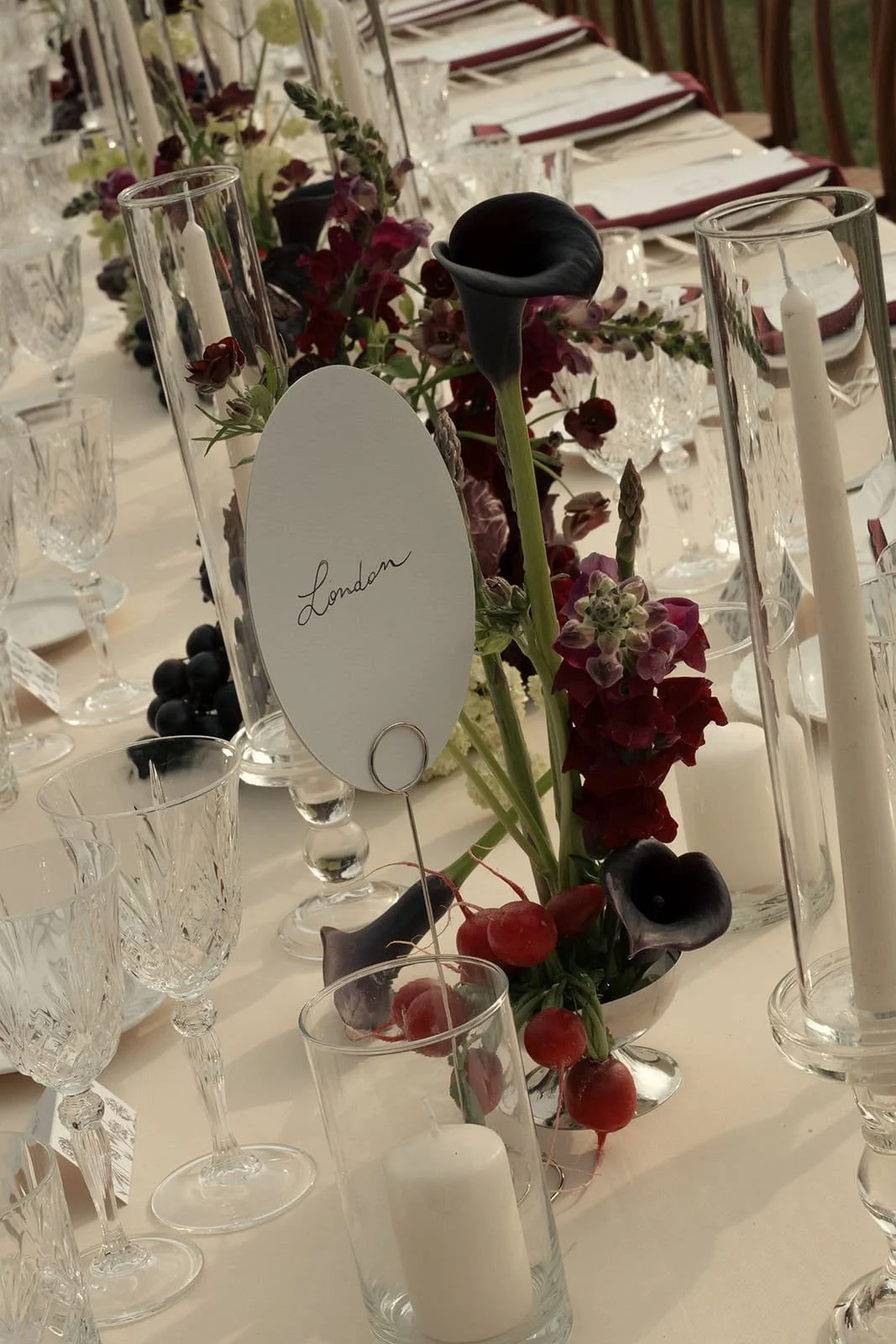 Florence wedding dinner tables featuring flowers, fruit, greenery, and vegetables