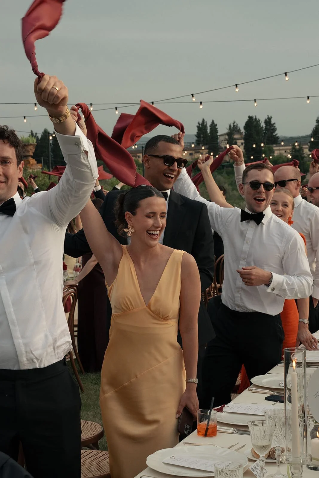 Wedding dinner in Tuscany with burgundy napkins