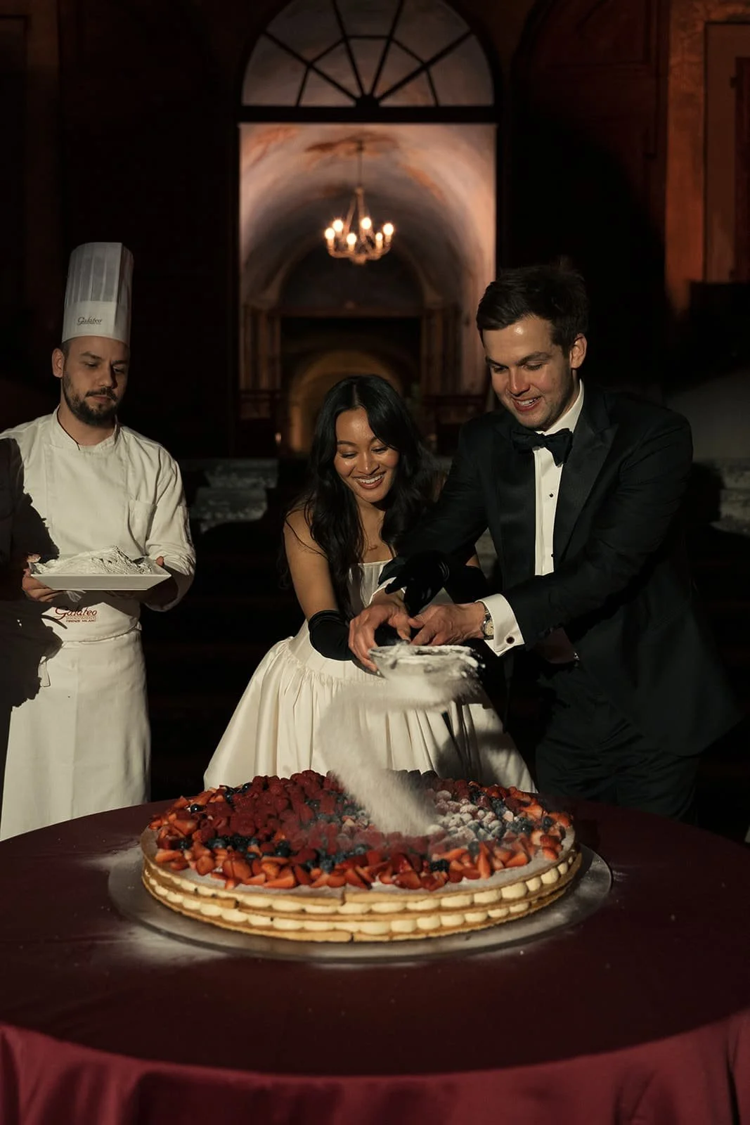 Wedding guests watching a traditional Italian millefoglie being prepared live