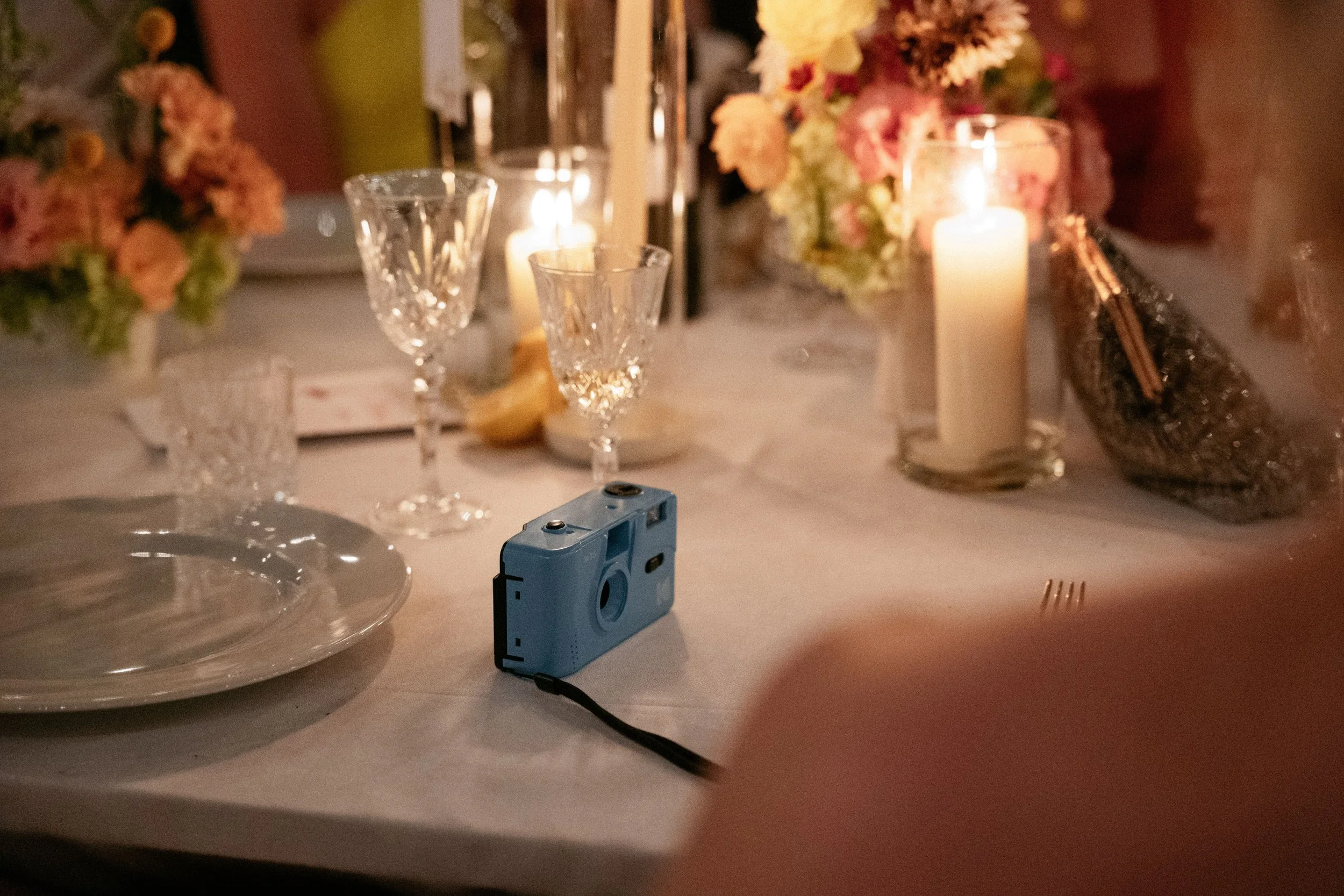 Polaroid on dinner table of destination wedding