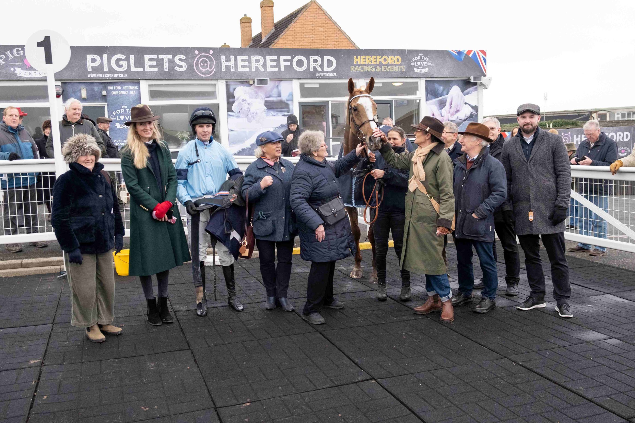 Winning owners celebrate the hat-trick!