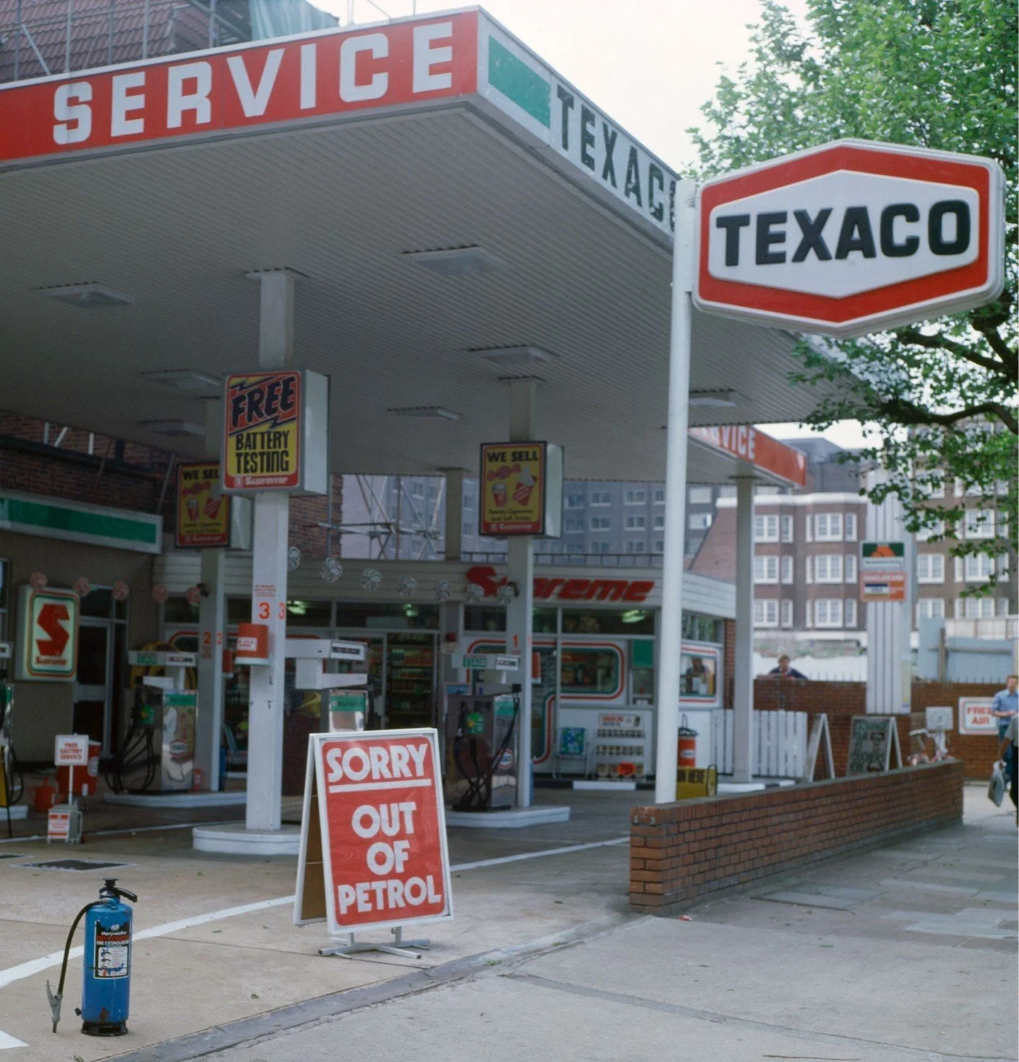LONDON, ENGLAND - 1974: A Texaco petrol station showing an "out of petrol" sign during a national fuel shortage after Saudi Arabia proclaimed an oil embargo targeted at nations that supported Israel during the Yom Kippur War, circa 1974. (P