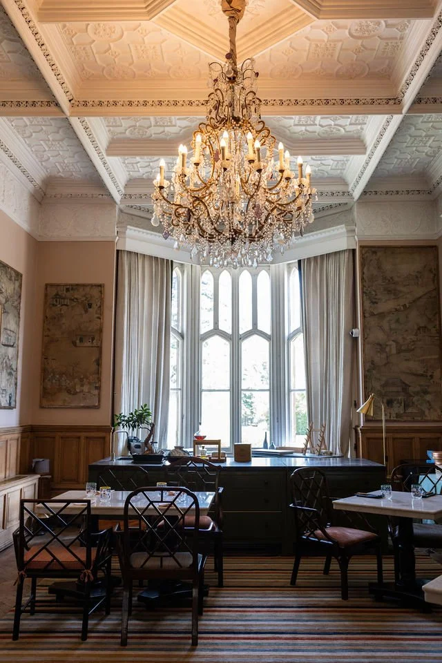 Chandelier and Gothic bay window in the dining room at Oakley Court