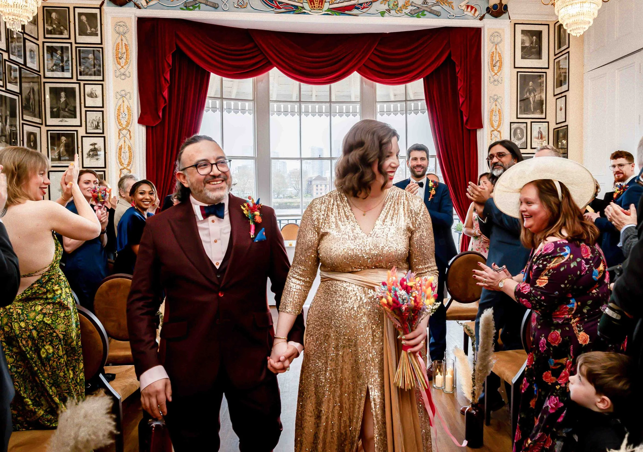 Newlyweds walking down the aisle at Trafalgar Tavern wedding ceremony