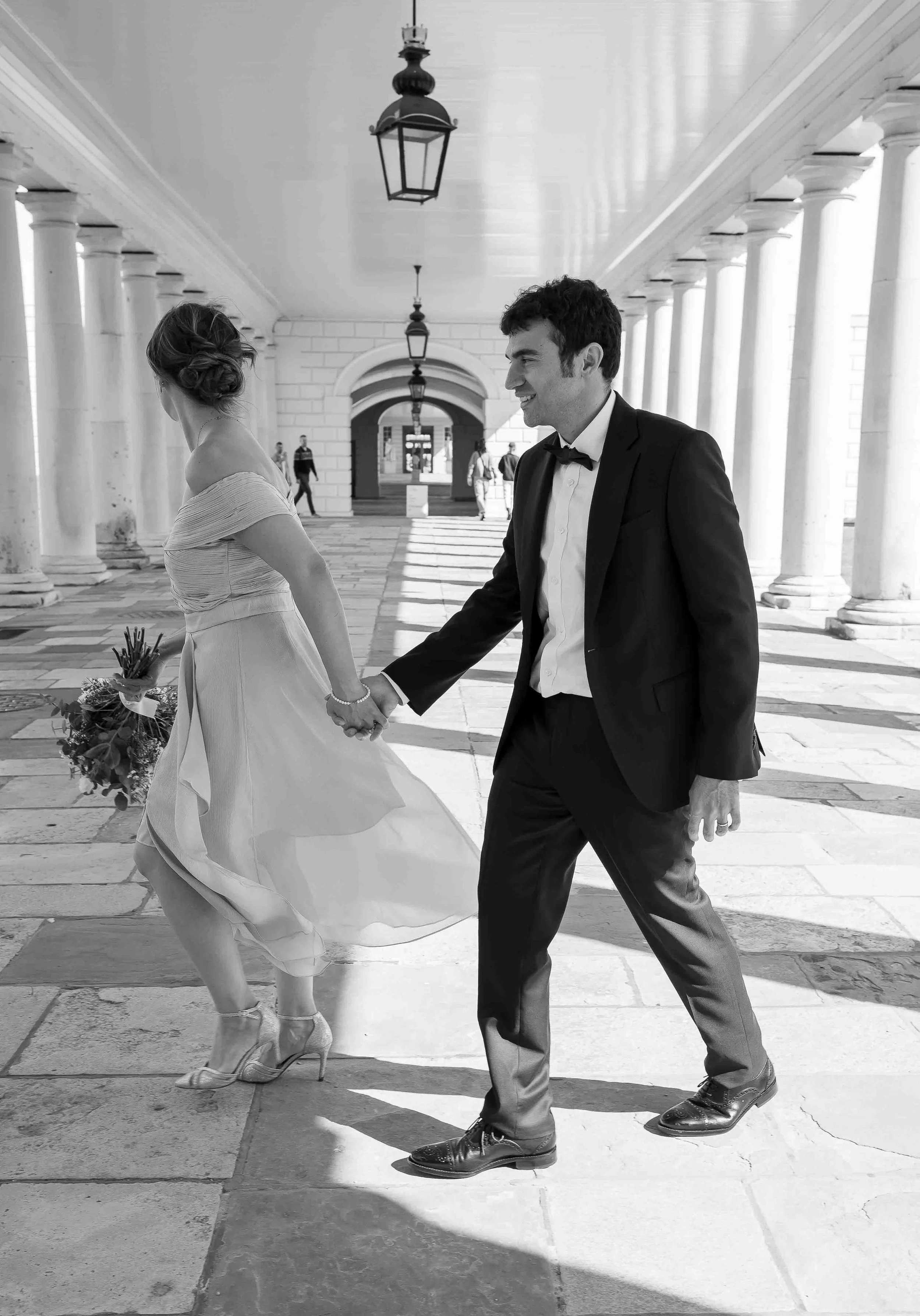 Couple walking through the colonnades at Queen’s House Greenwich